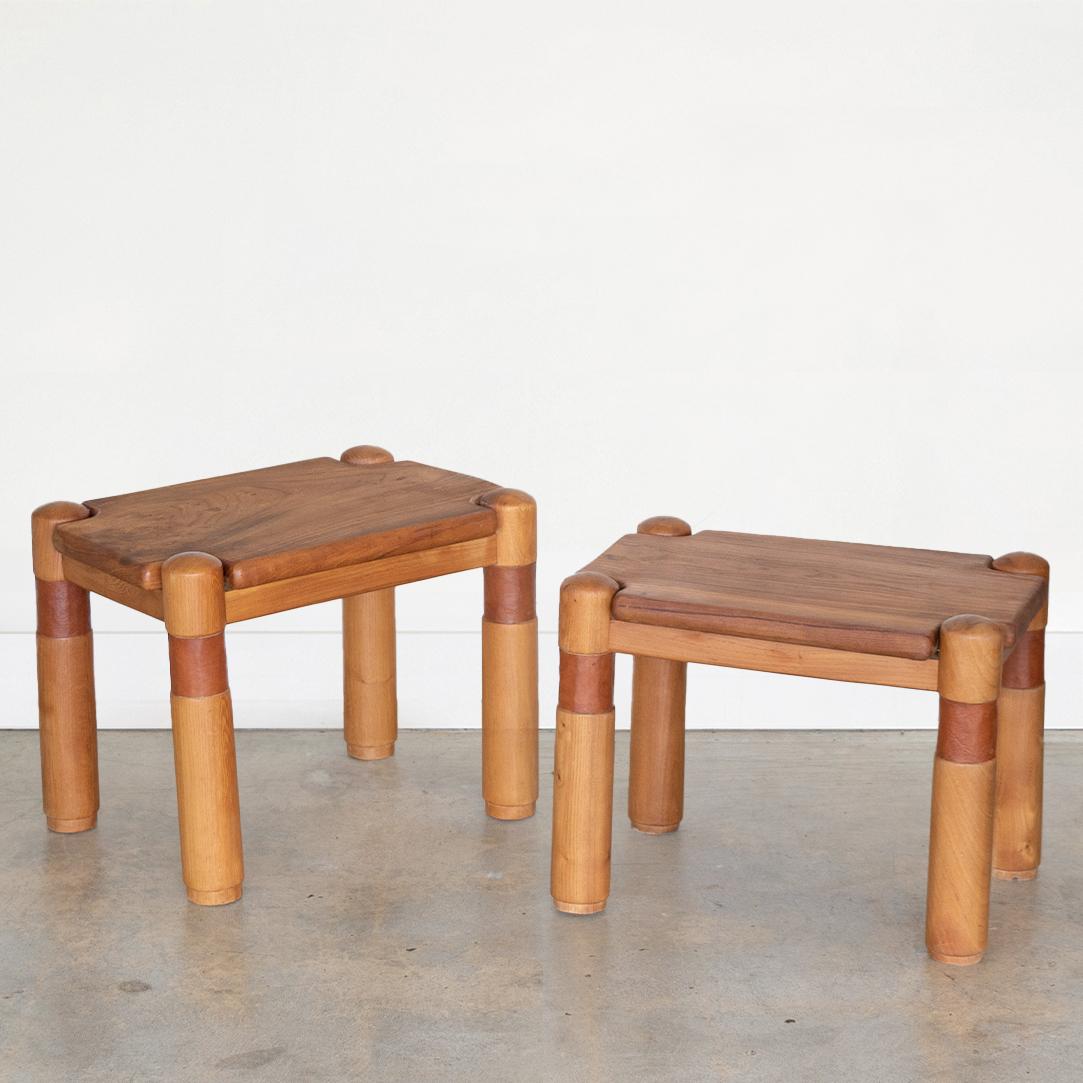 Vintage pair of low teak wood side tables from France, 1970's. Rectangular tops with four post legs and saddle leather wrapped detail. In great vintage condition with tops refreshed. 