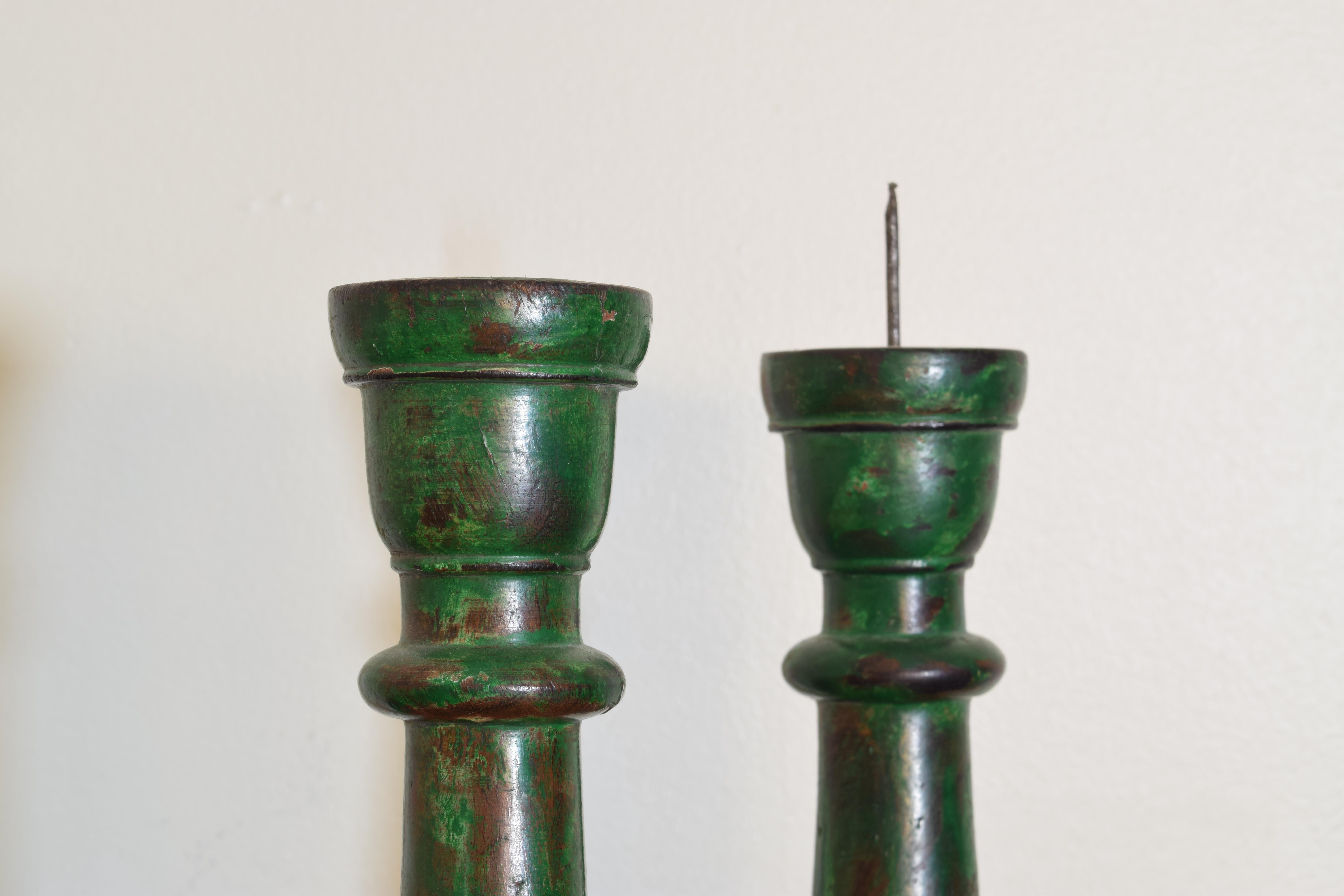 Italian Pair of French LPhilippe Style Turned and Green Painted Wooden Candlesticks