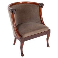 Coppia di poltrone francesi in mogano con teste di ariete attribuite a Jacob Desmalter