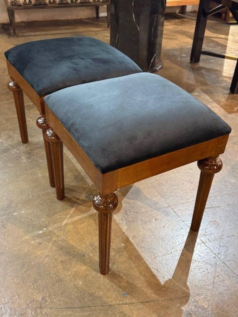 This product is a pair of French Mahogany Charles X style benches. These are designed in the traditional Charles X style, known for its elegance and craftsmanship. Made of high-quality mahogany wood and upholstered in a black velvet fabric, these