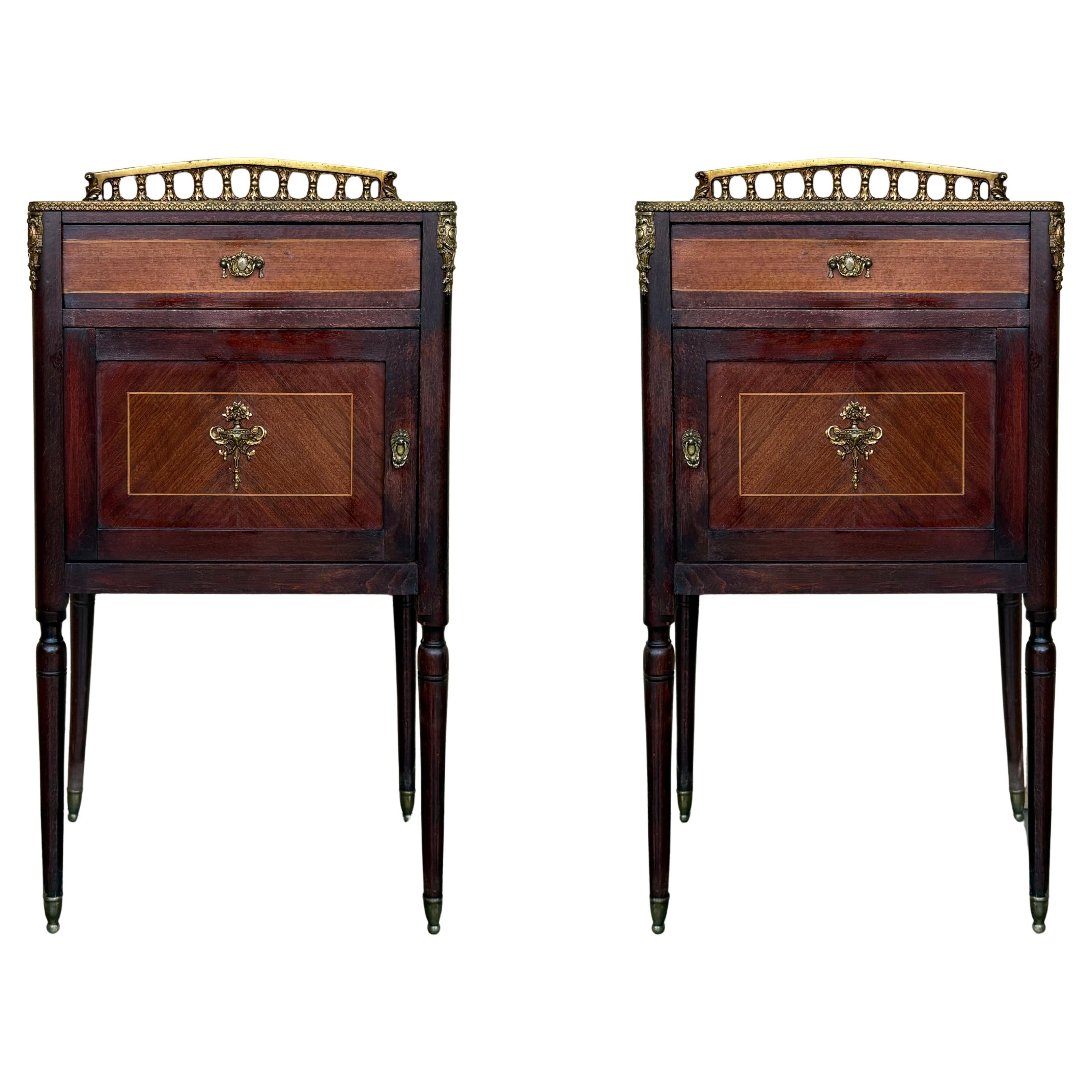 Pair of French Mahogany Nightstands with Drawer, Door and Bronze Crest For Sale