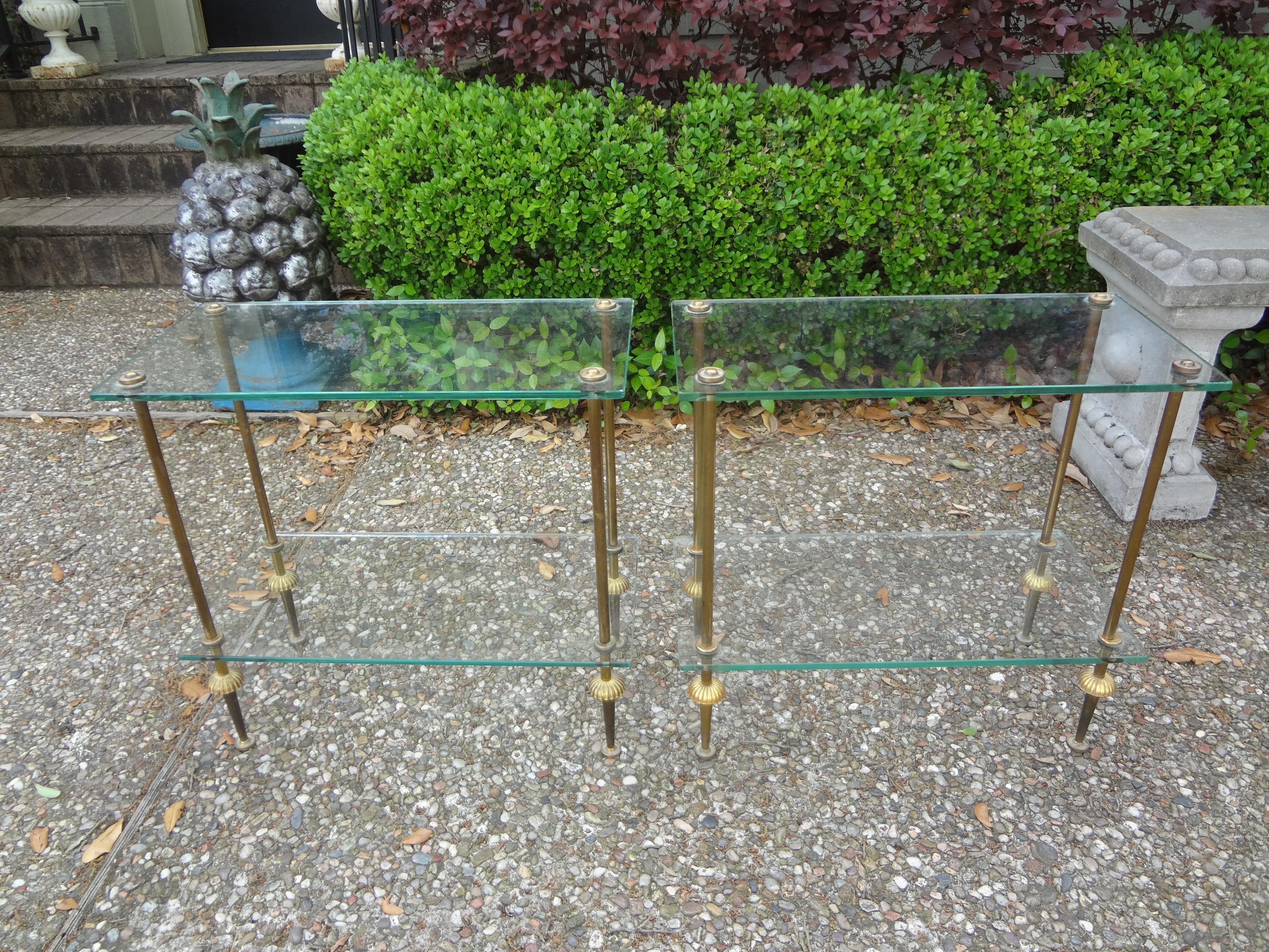 Pair of French Maison Bagues attributed brass and glass tables.
Striking pair of French Maison Bagues attributed brass and glass side tables. This gorgeous versatile pair of Maison Bagues tables or gueridons can be used together as a coffee table or