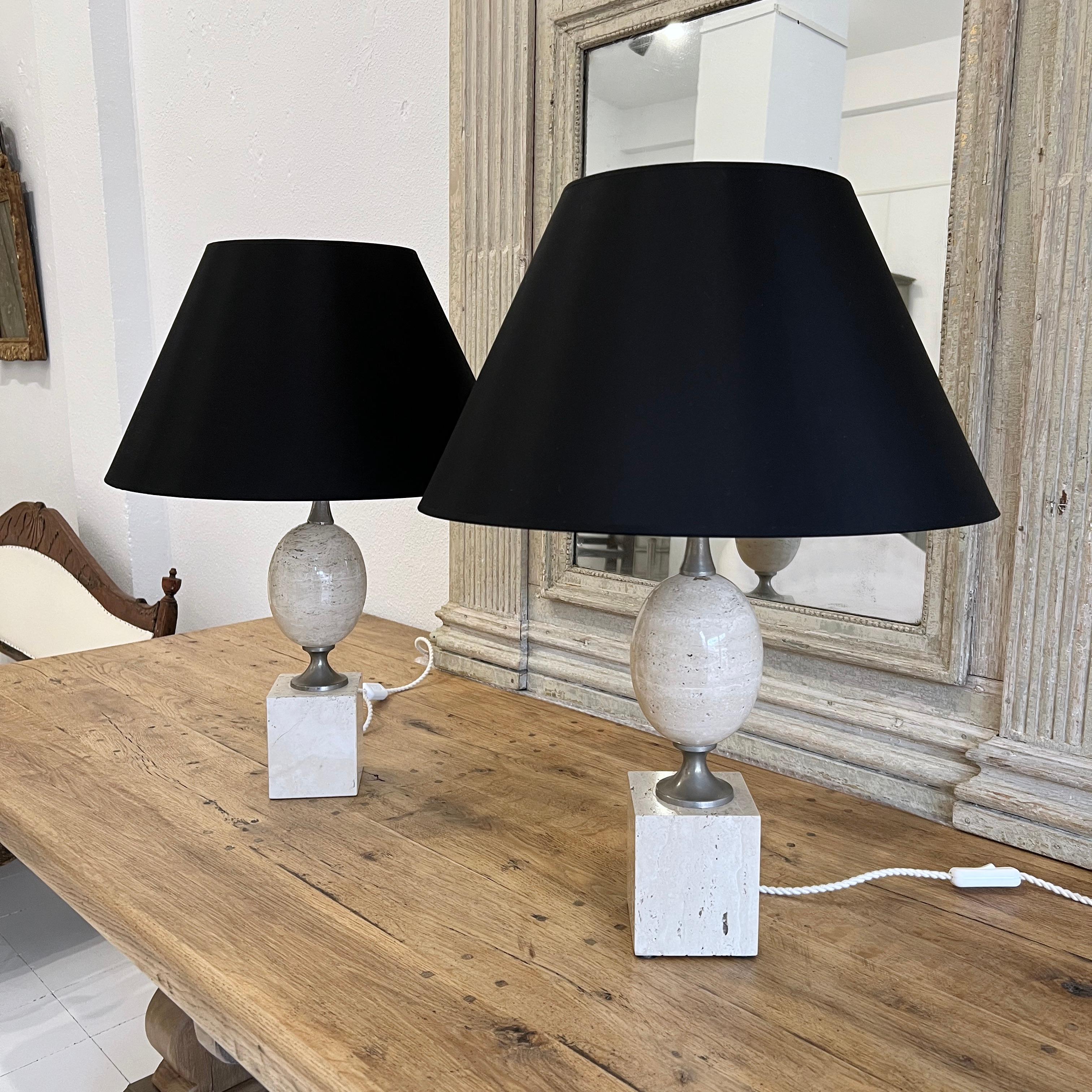 1960s French Maison Barbier pair of lamps designed by Philippe Barbier, made of travertine marble and nickel hardware. The high of the lamps is 40cm without shades. They have been rewired. 

The shades are not included in the selling price.

