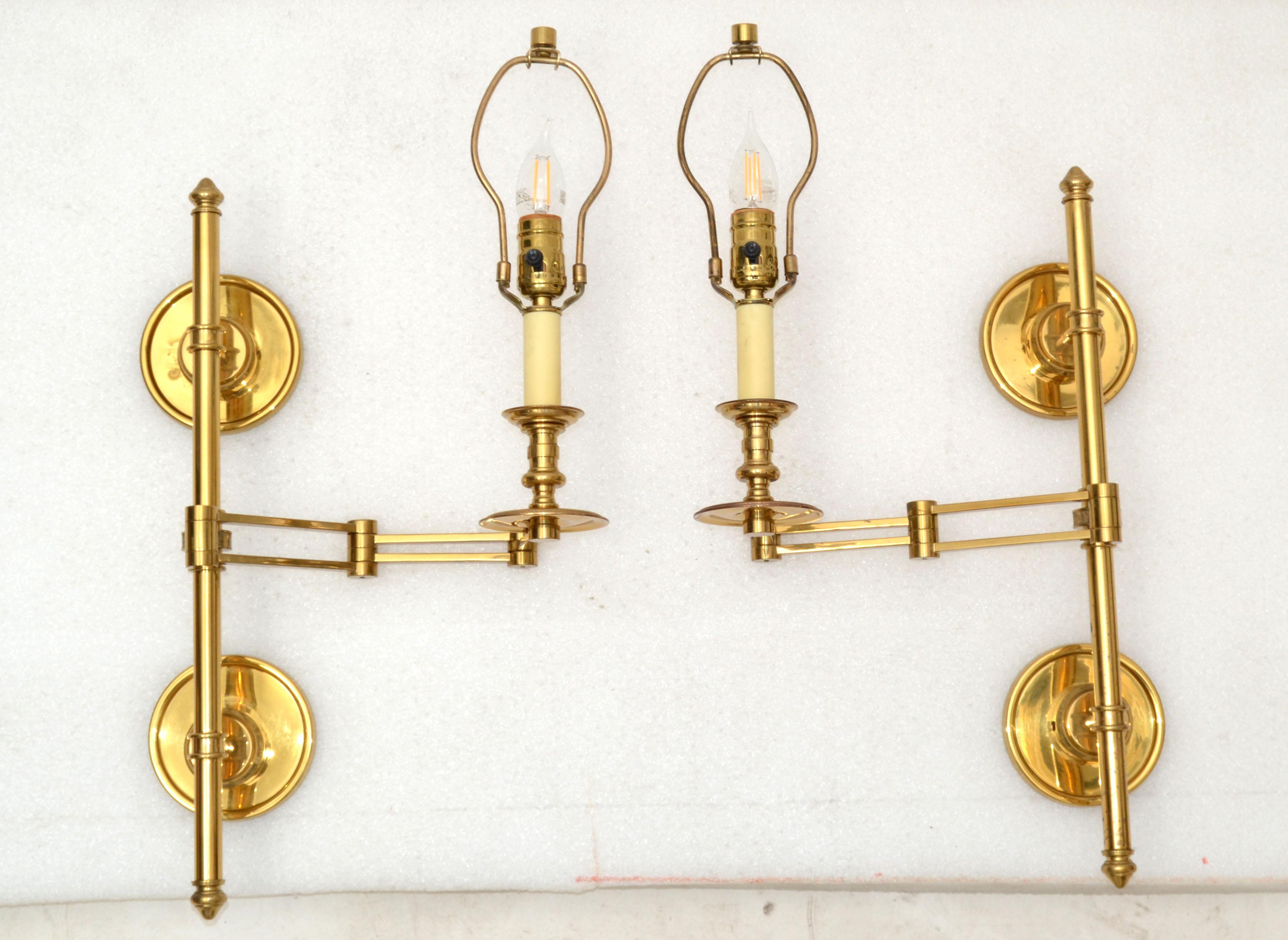 Very elegant pair of two patinas brass retractable Maison Jansen Sconces France with drum shade in black & gold.
The pair comes with 4 back plates and 2 Harps.
Wired for the US each sconce takes one light bulb with max. 60 watts.
Measurement: Max