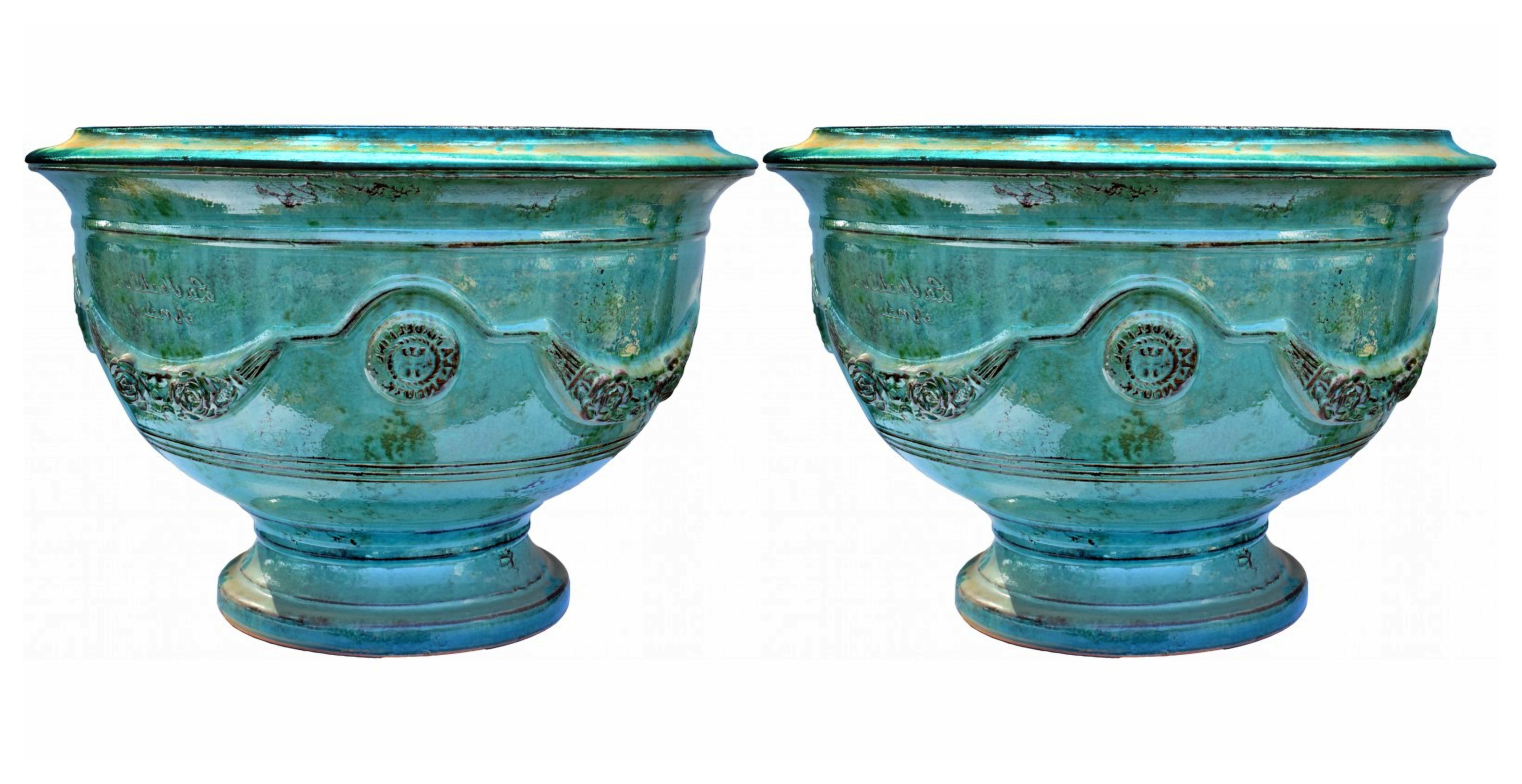 Paire de vases en majolique des Cévennes (France) début 20ème siècle

Les pots d'Anduze sont une spécialité artisanale des Cévennes, région culturelle et chaîne de montagnes du centre-sud de la France, située au sud-est du Massif central. Il