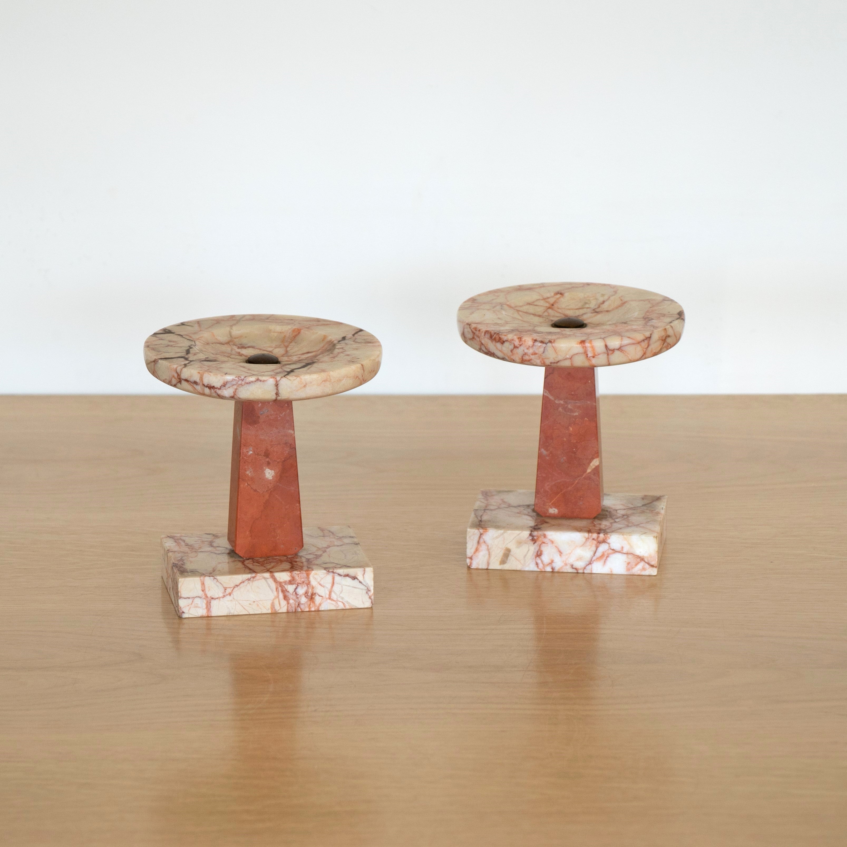 Wonderful pair of marble objects from France. Pale pink top and base with a coral stem. Perfect as bookends, candle rests, or decorative objects. 

Measures 5