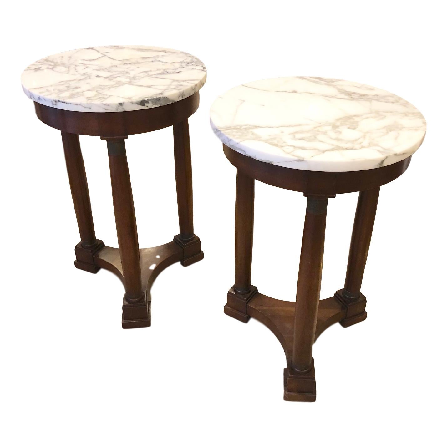A pair of circa 1940s French neoclassic style marble-top side tables.

Measurements:
Height 25.5