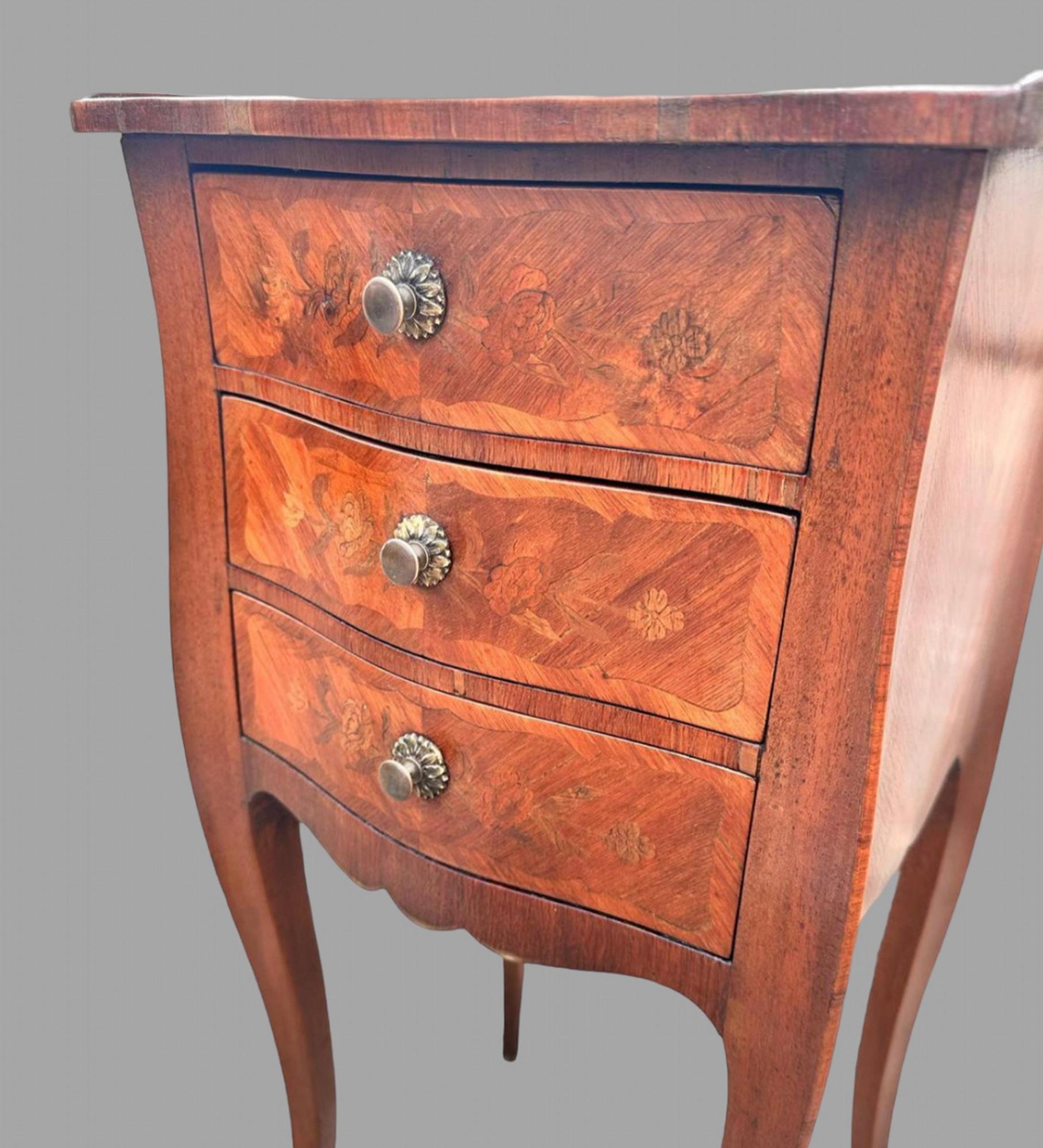 An Attractive Pair of French Marquetry Kingwood Bedside Tables. With three working drawers and having great detail and colour they stand well on original fine cabriole legs