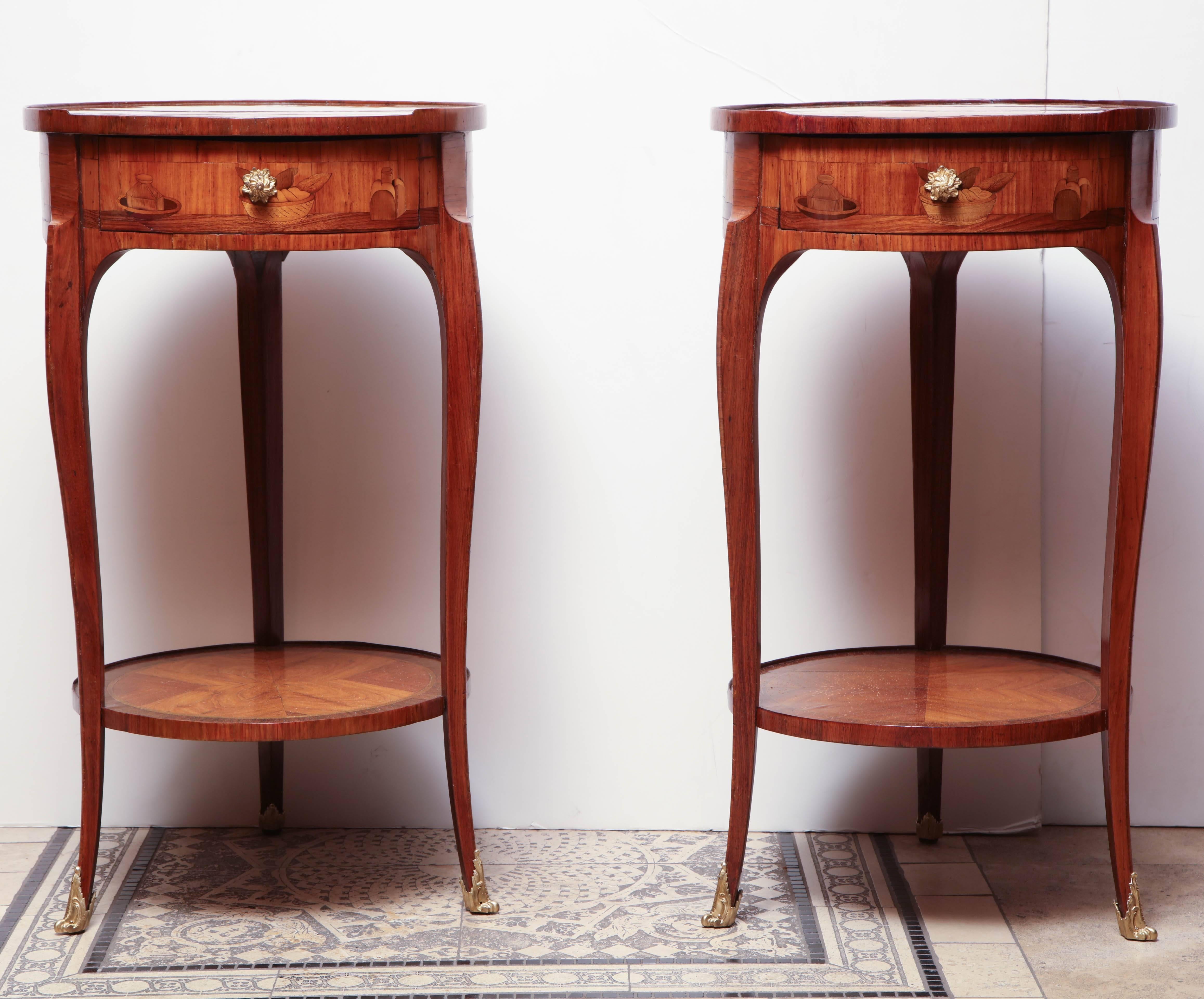 Pair of French Louis XV marquetry inlaid kingwood round side table with inlaid panel sides and shelf stretcher base. With bronze sabots.