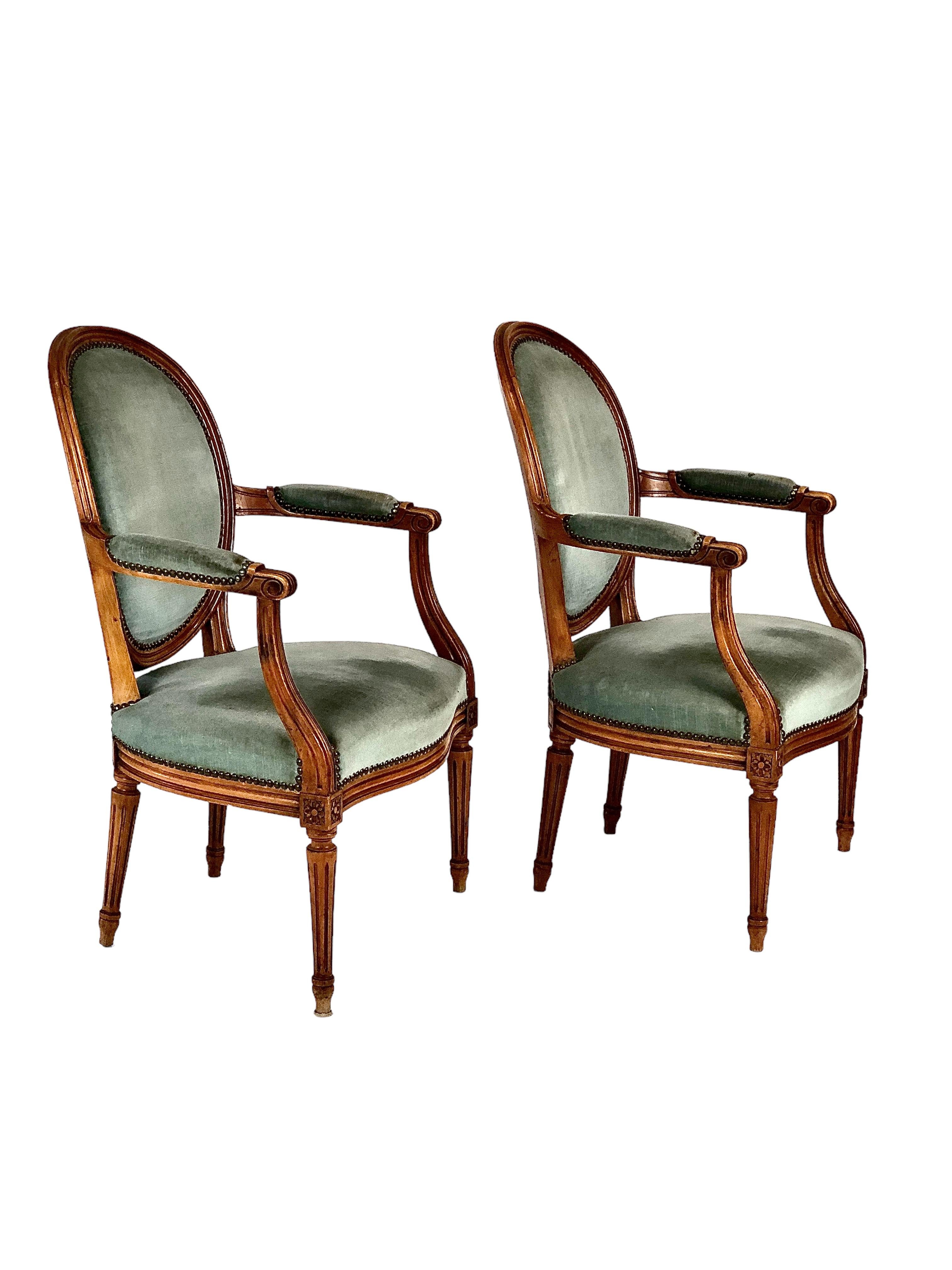 Carved Pair of French Louis XVI Medaillon Back Armchairs