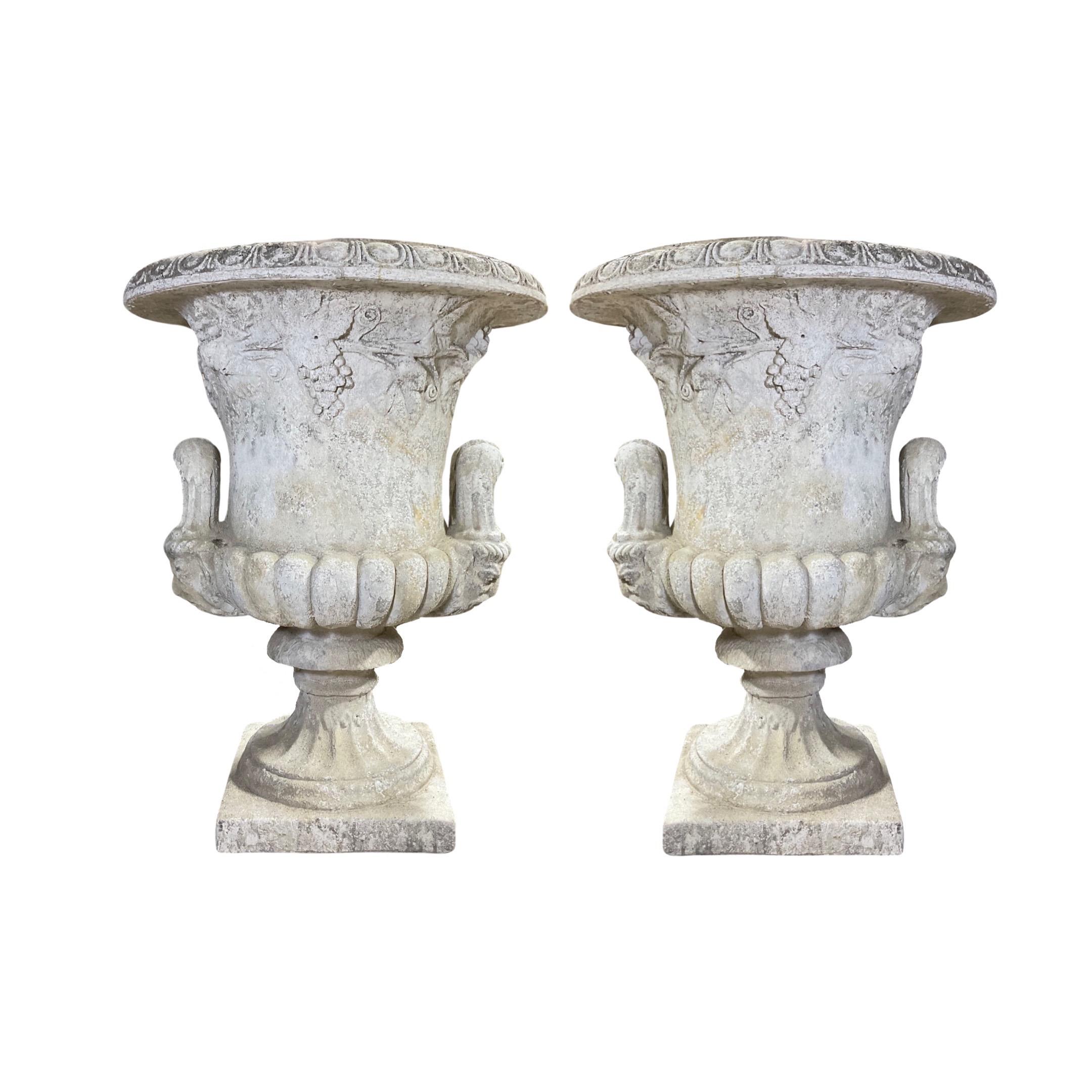 These 19th-century, Medici-style French planters are the perfect addition to your outdoor space. Expertly crafted from a durable composite mix, this pair of planters adds a classic and timeless look to your decor. With a pair of two, you'll be able
