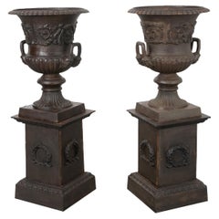 Pair of French Metal Urns on Pedestals