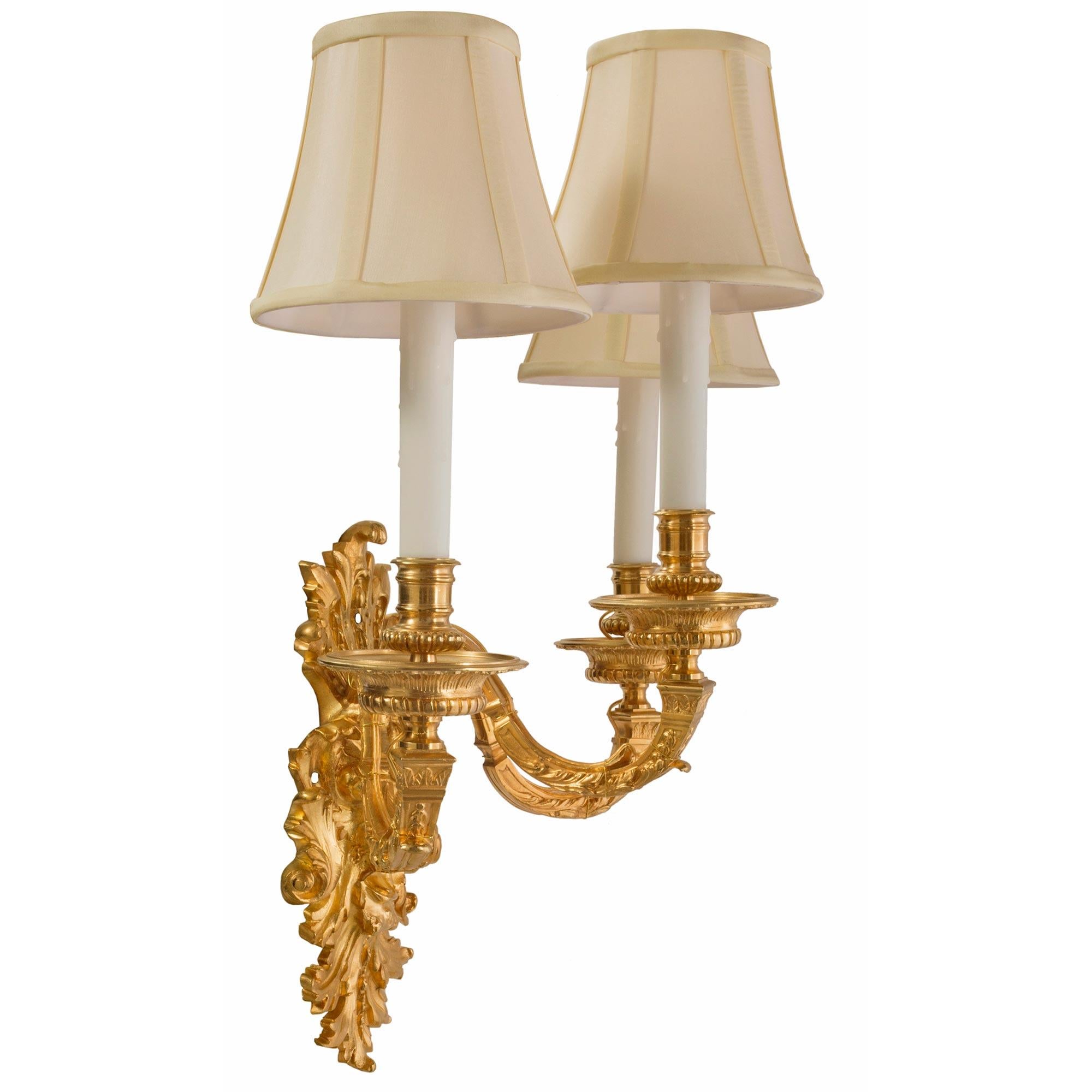 Pair of French Mid-19th Century Louis XIV St. Ormolu Three-Arm Sconces In Good Condition For Sale In West Palm Beach, FL