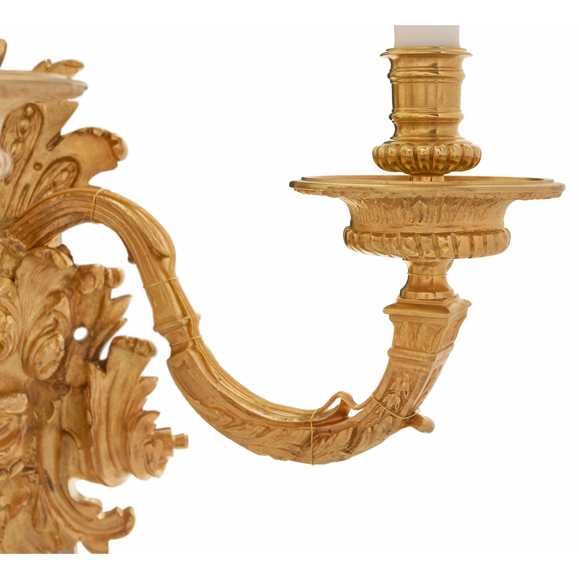 Pair of French Mid-19th Century Louis XIV St. Ormolu Three-Arm Sconces For Sale 1
