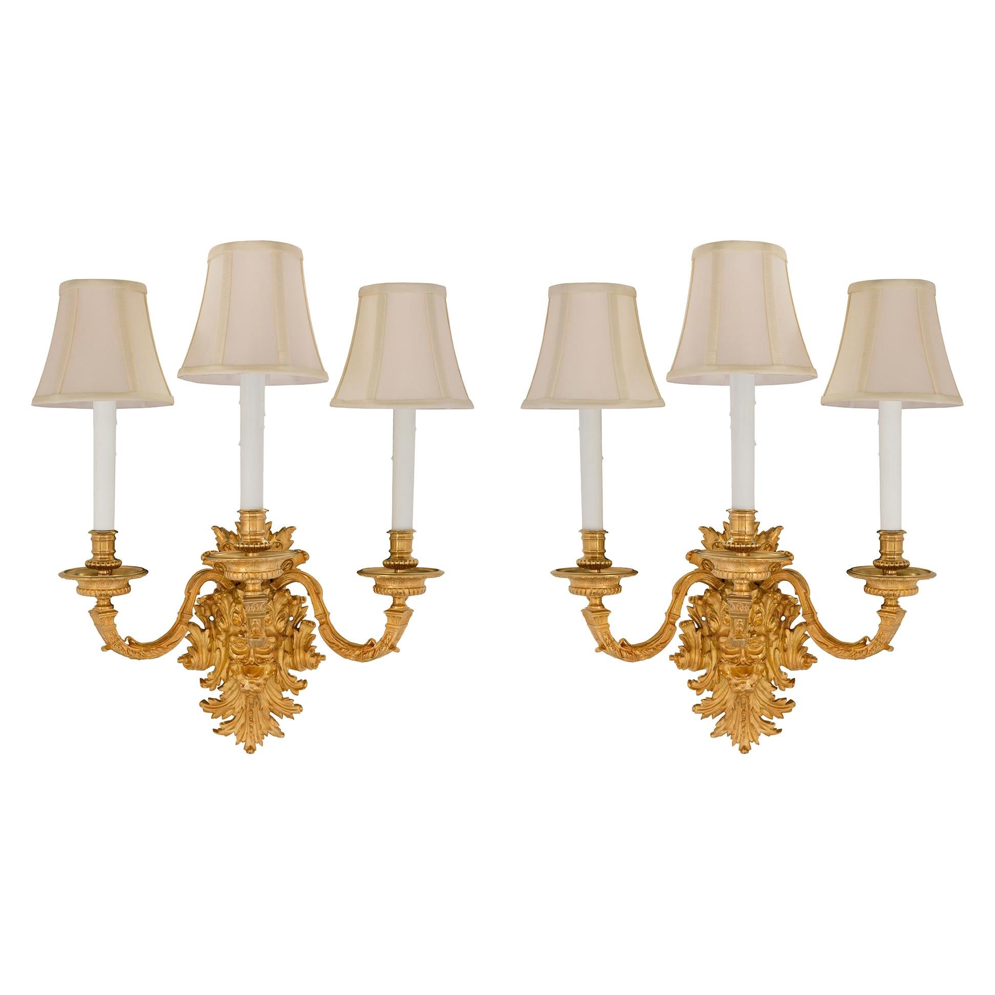 Pair of French Mid-19th Century Louis XIV St. Ormolu Three-Arm Sconces For Sale