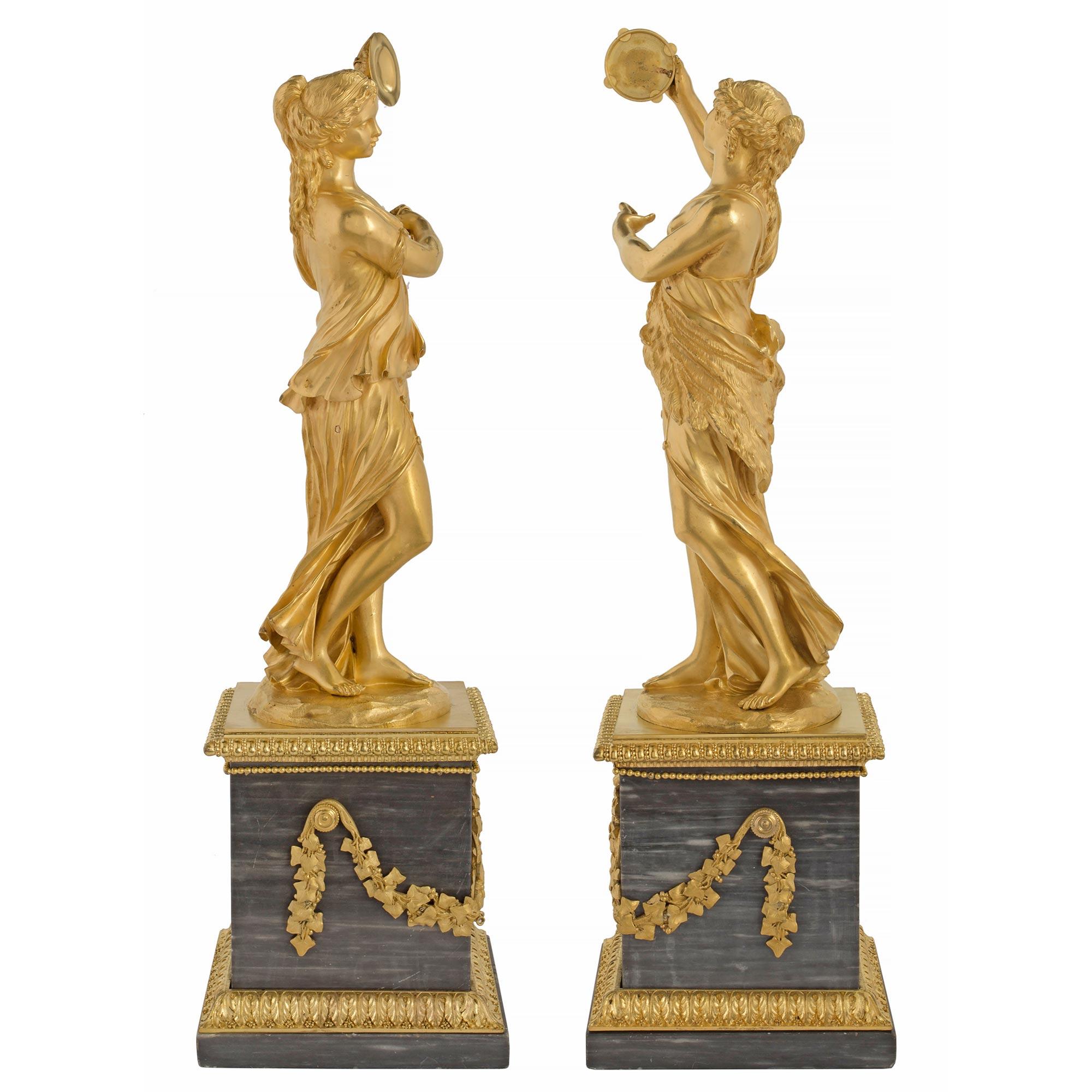 A most elegant and extremely high quality pair of French mid 19th century Louis XVI st. ormolu, Wedgwood and marble decorative statues. Raised by rectangular shaped Bleu Turquin marble plinths with handsome acanthus leaf designed ormolu bands below