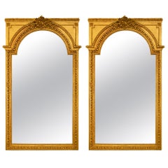 Pareja de espejos franceses de madera dorada estilo Luis XVI de mediados del siglo XIX