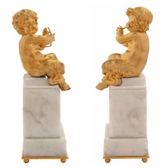 Pair of French Mid-19th Century Louis XVI Style Statues of Young Cherubs