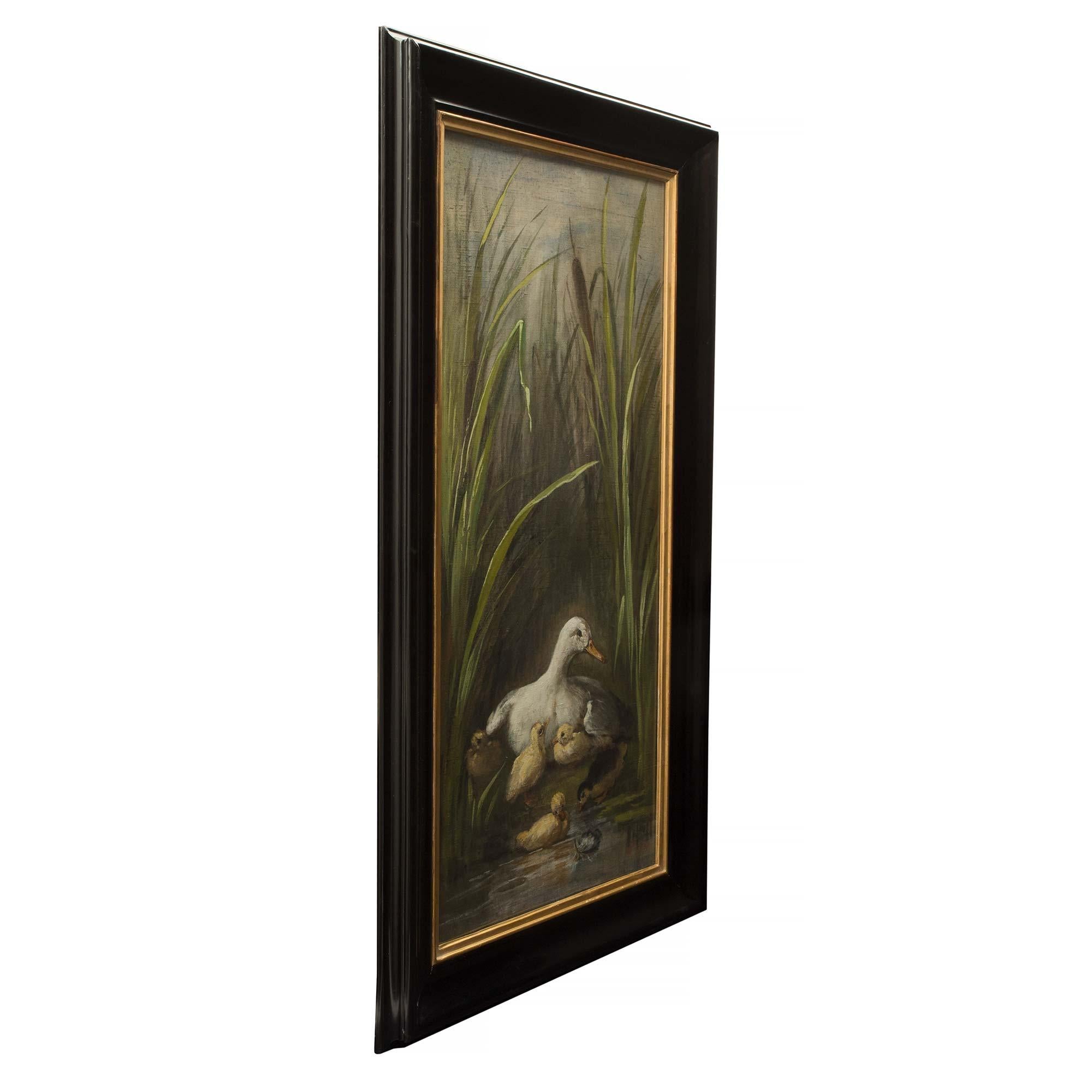 A pair of lovely French mid 19th century Napoleon III period oil on canvas, dated 1870. Each painting is within an molded edge frame with giltwood inner border. One painting depicts a duck amidst her ducklings in tall water flora. The other shows a