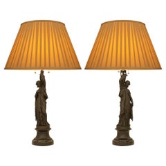 pair of French 19th century Neo-Classical st. patinated Bronze and marble lamps