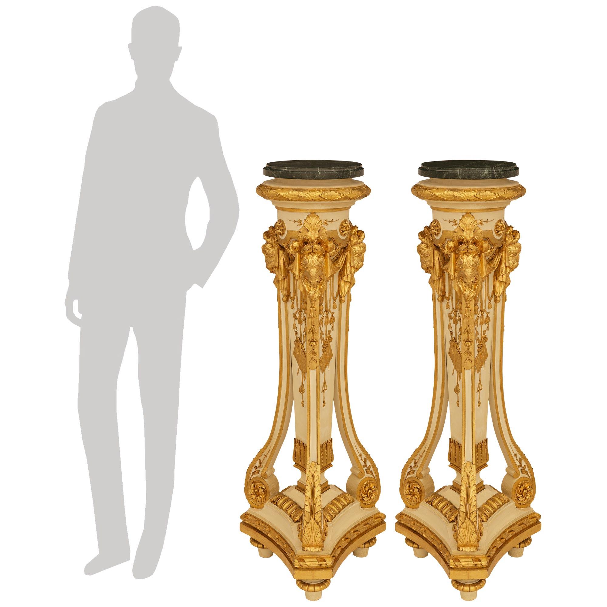 A sensational and most impressive pair of French mid 19th century patinated wood and Giltwood Torchière pedestals. Each stunning pedestal is raised by a triangular base with an elegant Giltwood twisted ribbon designed edge all above toupie shaped