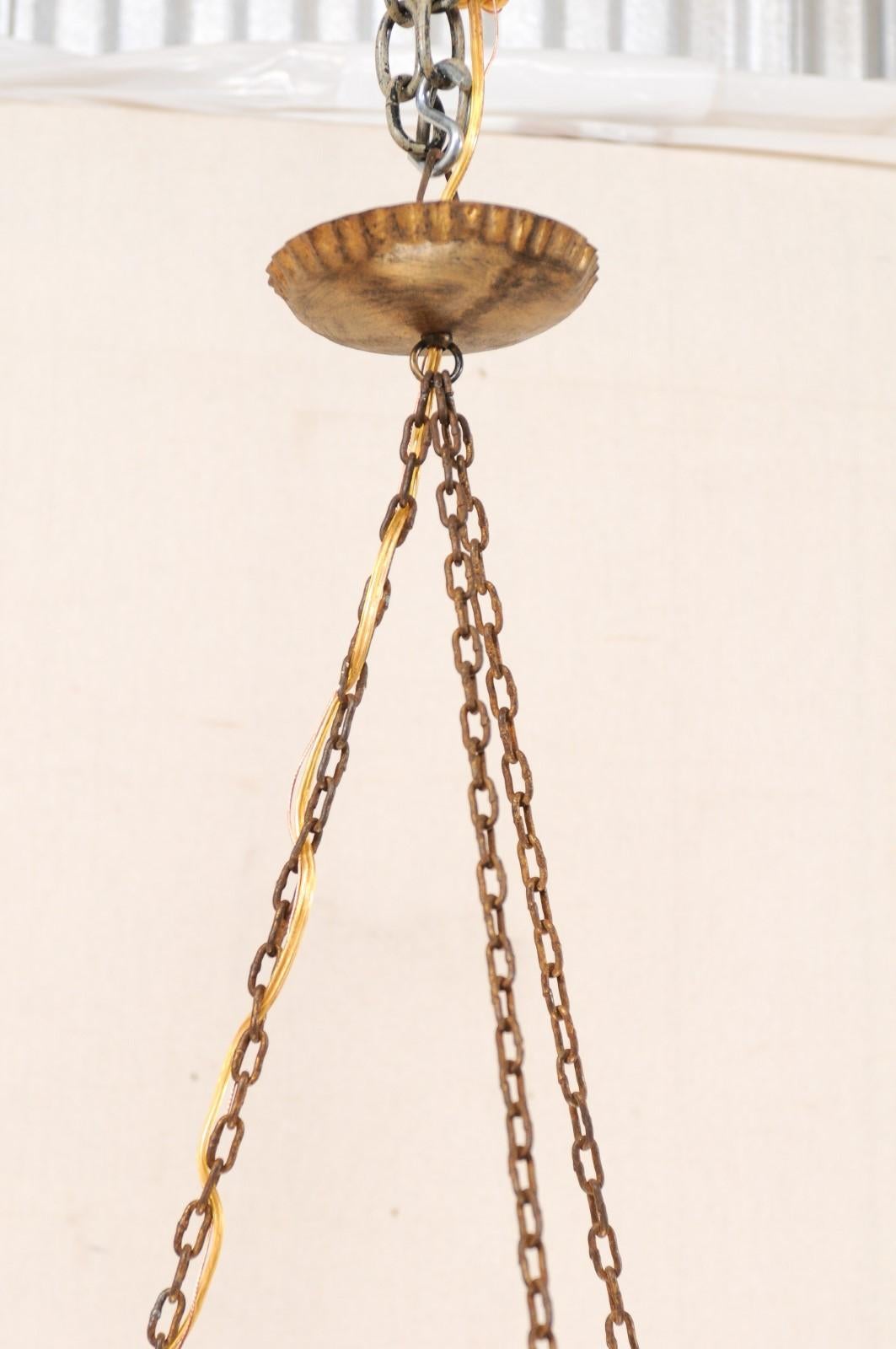 Metal Pair of French Mid-20th Century Iron Chandeliers with Three Torch Style Arms