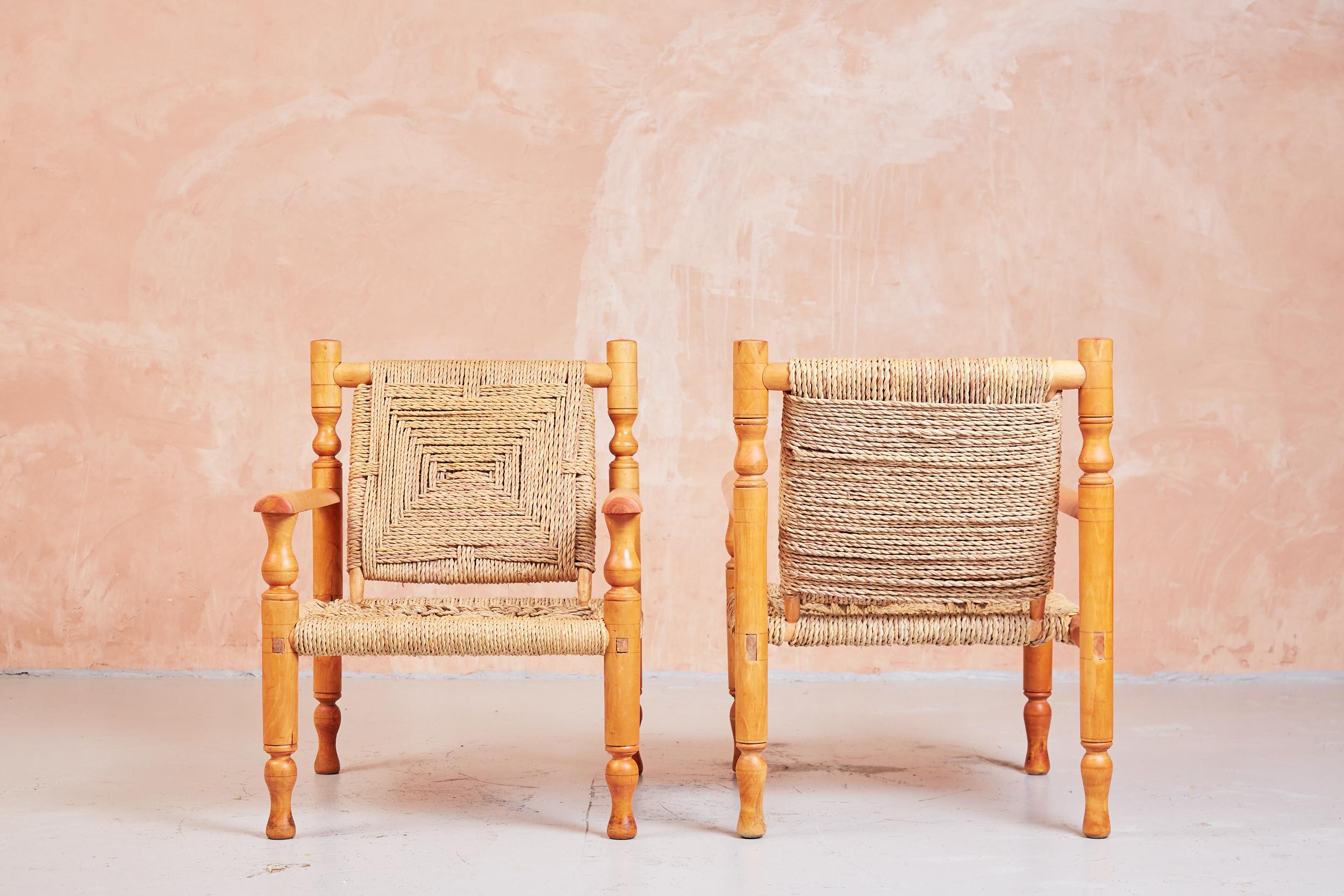 Armchairs by Adrien Audoux and Frida Minet.
Made in France, circa 1950s.
Fantastic patina to wood
Beechwood and abaca rope.

A pair of rare hand crafted Audoux Minet armchairs with footstool. They are extremely comfortable and compliment a touch of