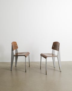 Pair of French Mid Century Dark Grey Wooden Metropole 305 Chairs by Jean Prouvé