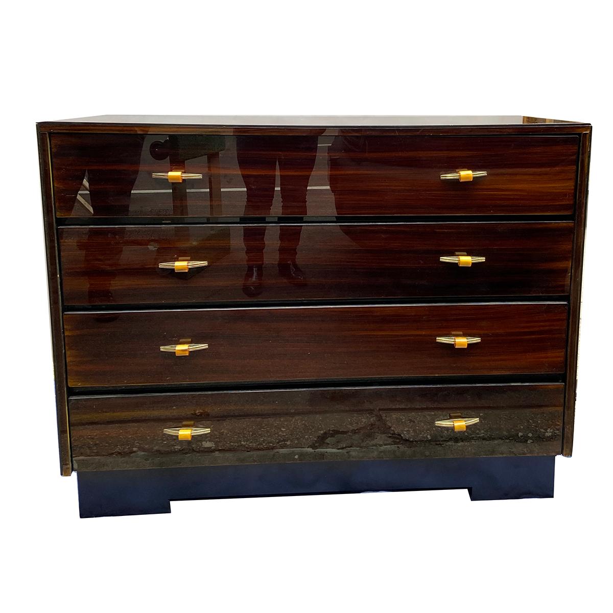 A pair of circa 1950s French verre églomisé chests of drawers with original finish and pulls and drawers retrofitted with a modern rail system.

Measurements:
Length 46