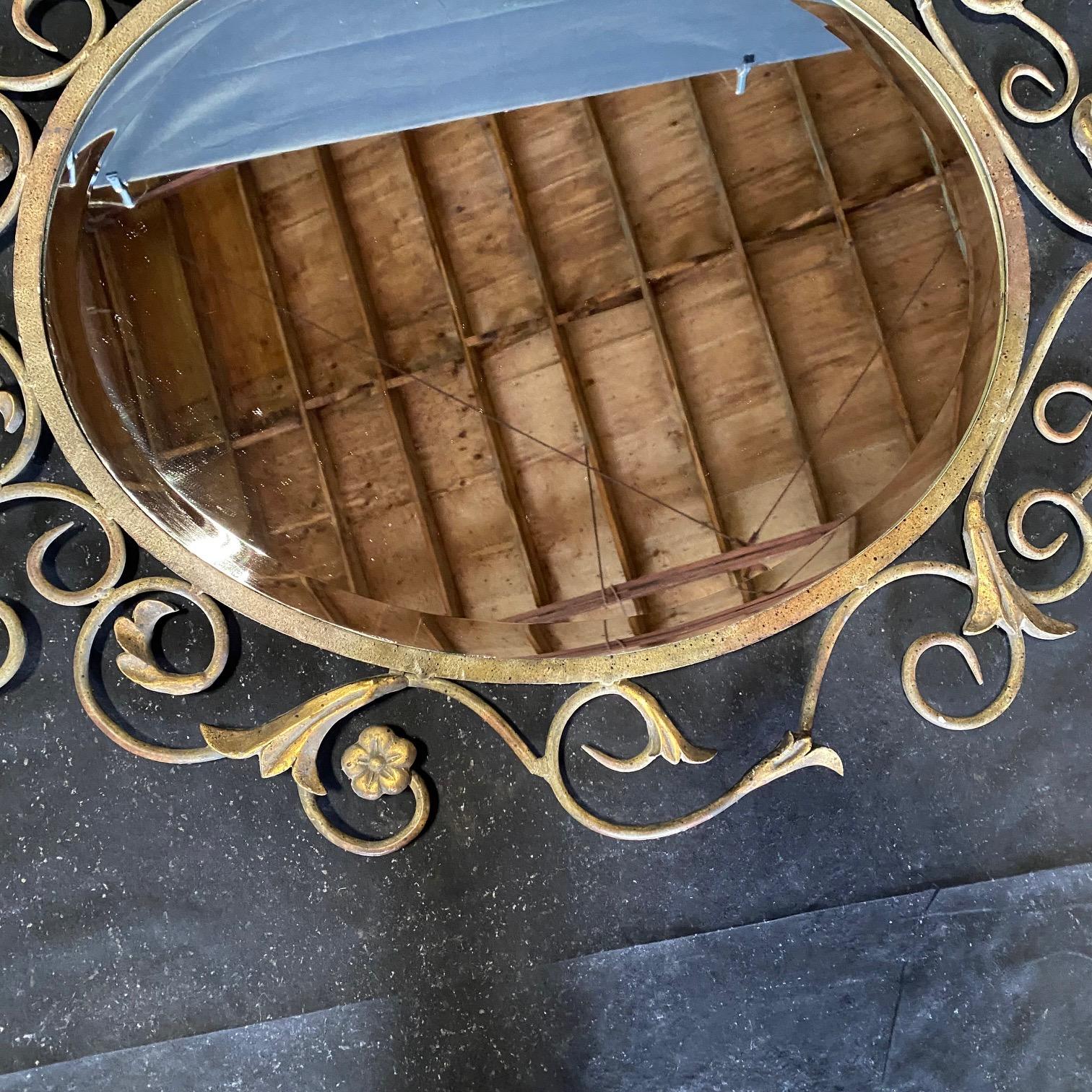 Pair of French Mid Century Fleur de Lis Scrolled Oval Beveled Wall Mirrors In Good Condition For Sale In Hopewell, NJ