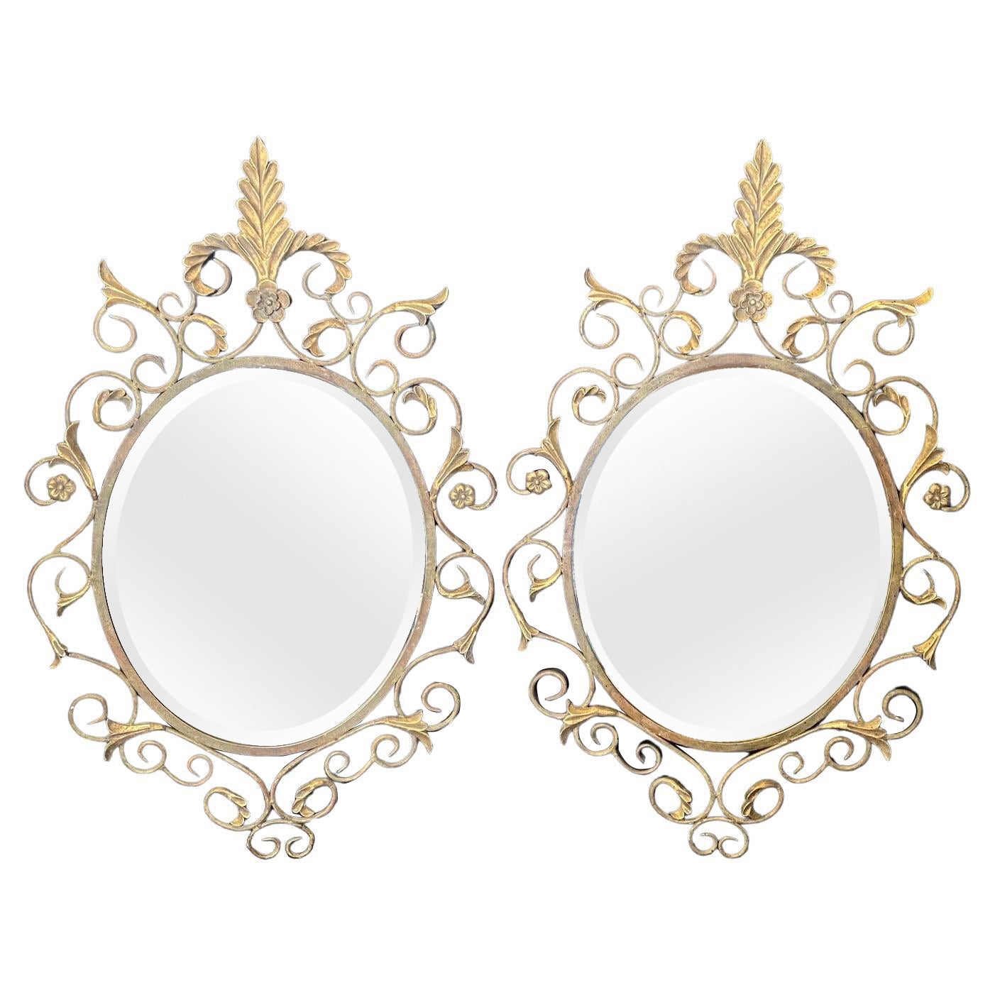 Pair of French Mid Century Fleur de Lis Scrolled Oval Beveled Wall Mirrors