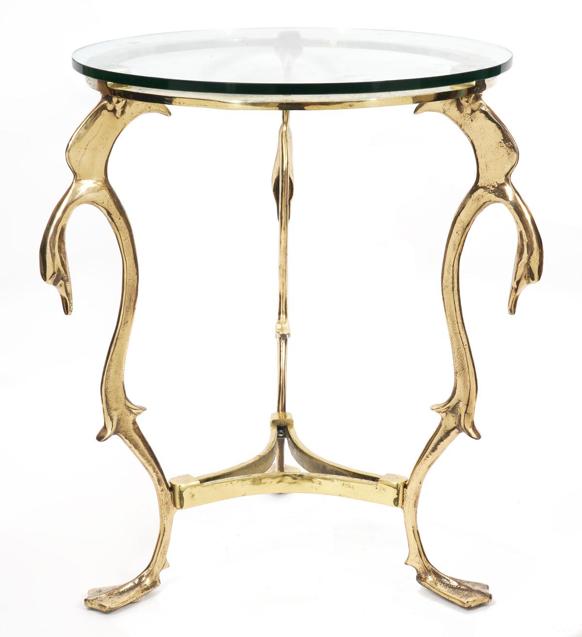 Of elegant almost organic form reminiscent of rococo style these French hammered bronze gueridon side tables feature three shaped and curved legs with swan heads and webbed swan feet supporting thick tempered glass tops.