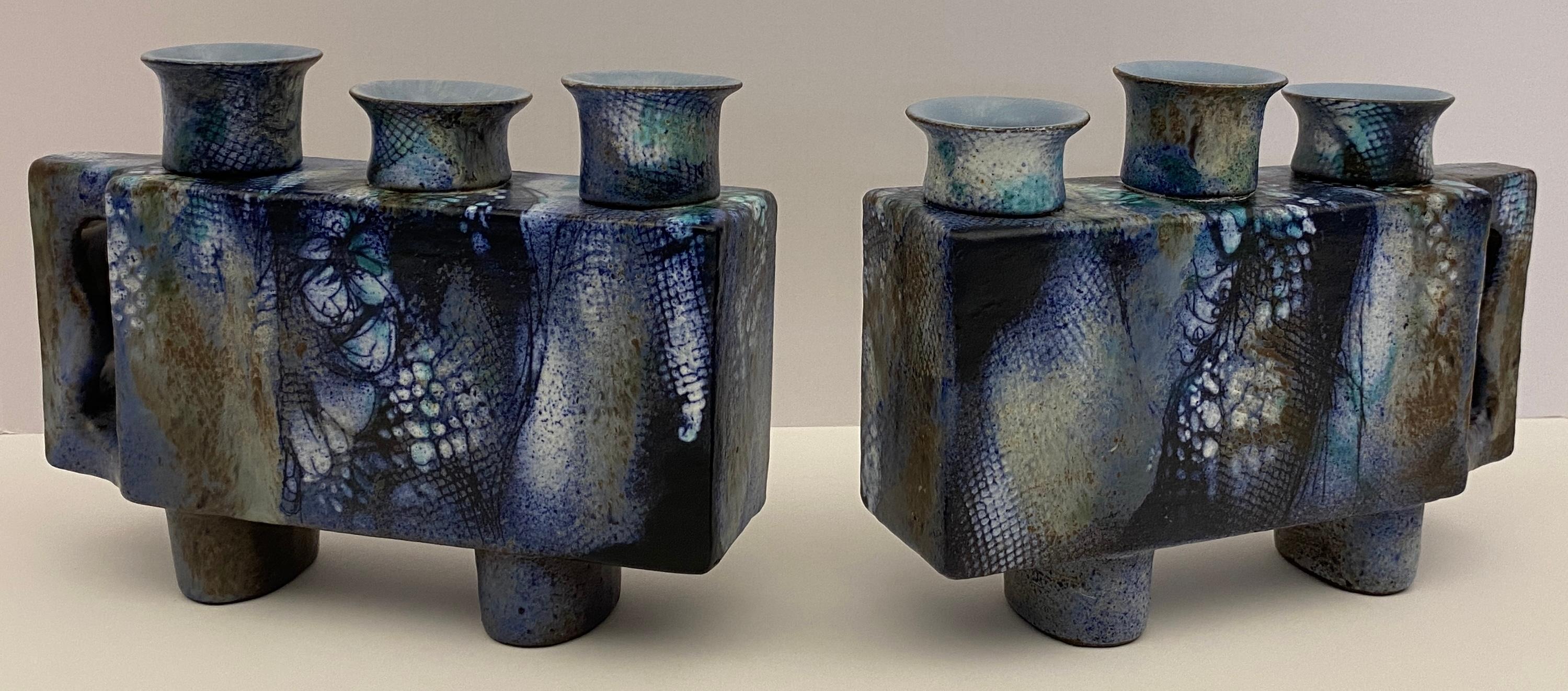 A striking pair of vintage French ceramic candle holders dating from the mid 20th century. 

This fine pair of French ceramic candleholders were created in the art pottery studios by the renowned artist ONET presumably in the town of Vallauris,