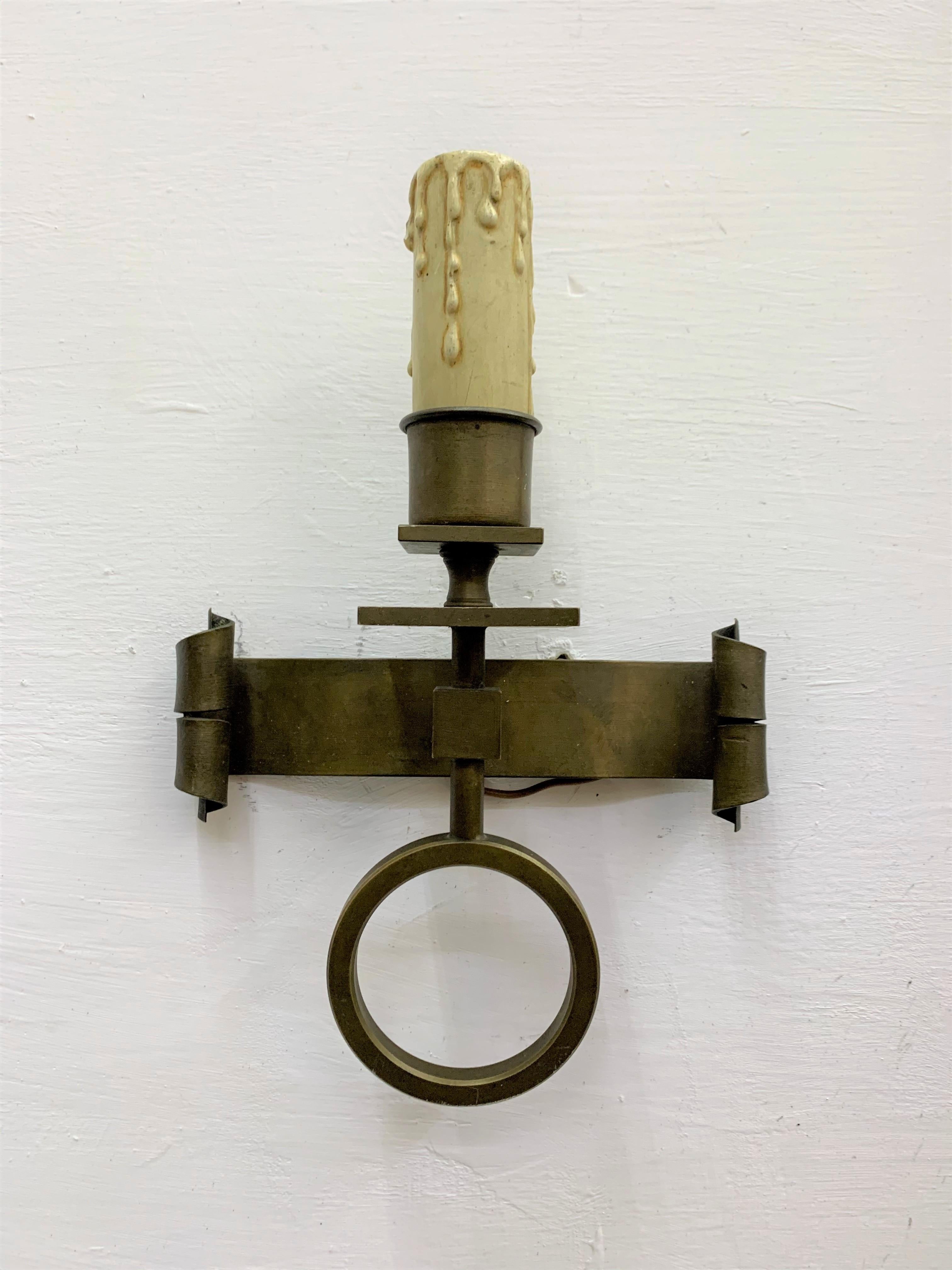 Pair of Mid-Century Modern sconces, handwrought in solid brass and carved wood bulb-holders. 
These Sconces originally had a screen attached to the bulb which can be replaced easily if desired.