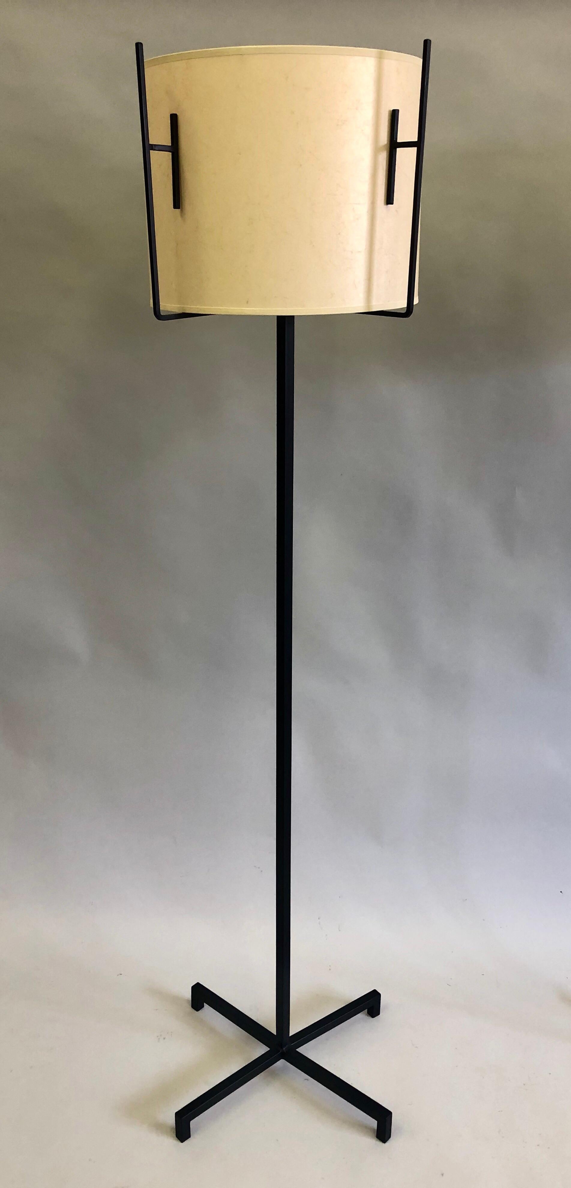 Wrought Iron Pair of French Mid-Century Modern Iron & Parchment Floor Lamps by Jacques Adnet For Sale
