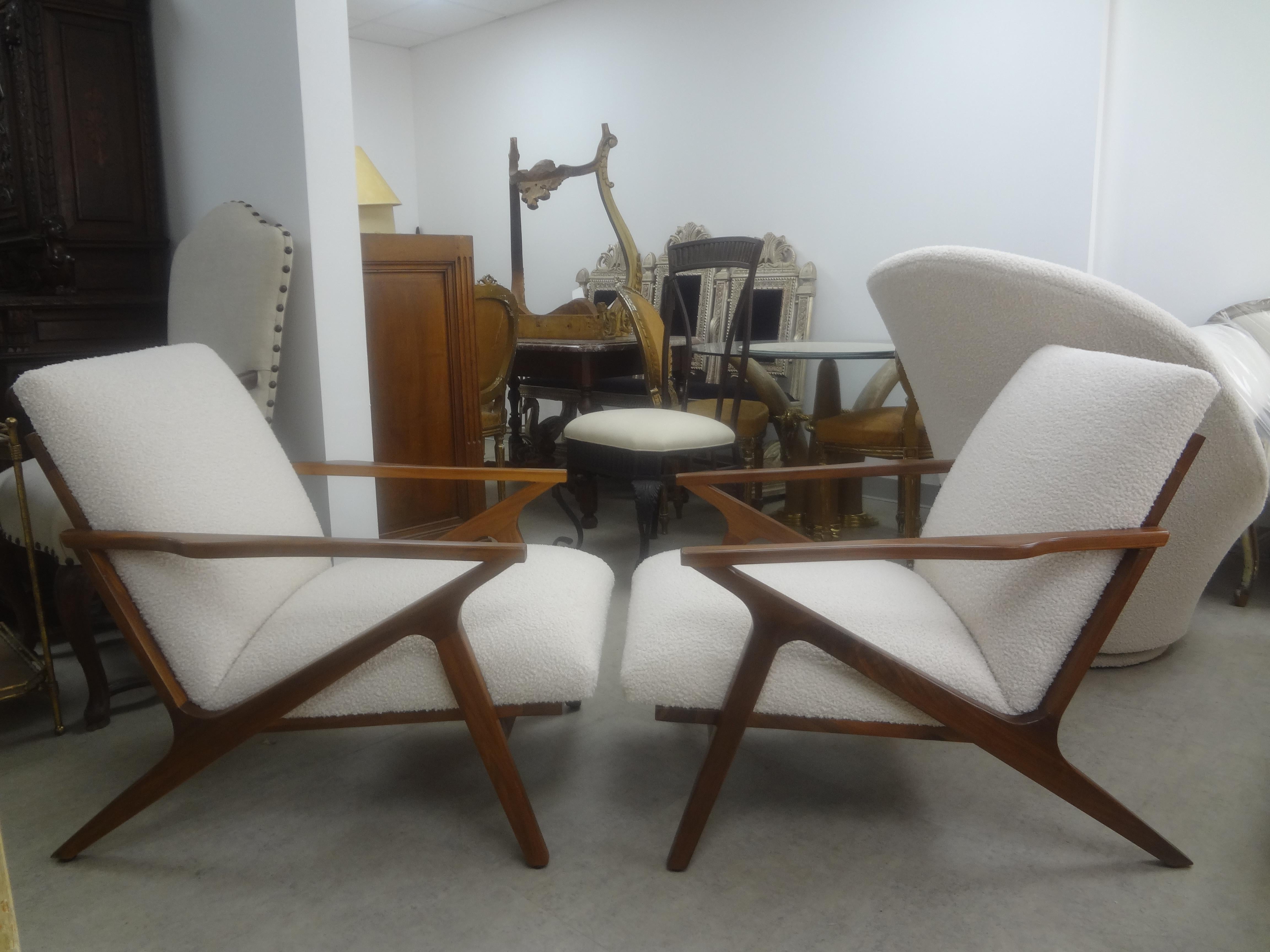 Pair of French Mid-Century Modern Jeanneret Style Lounge Chairs.
These stunning French Modernist lounge chairs are an interesting design and extremely comfortable. Professionally upholstered in plush cream boucle. In The Manner of Sornay, Arbus,
