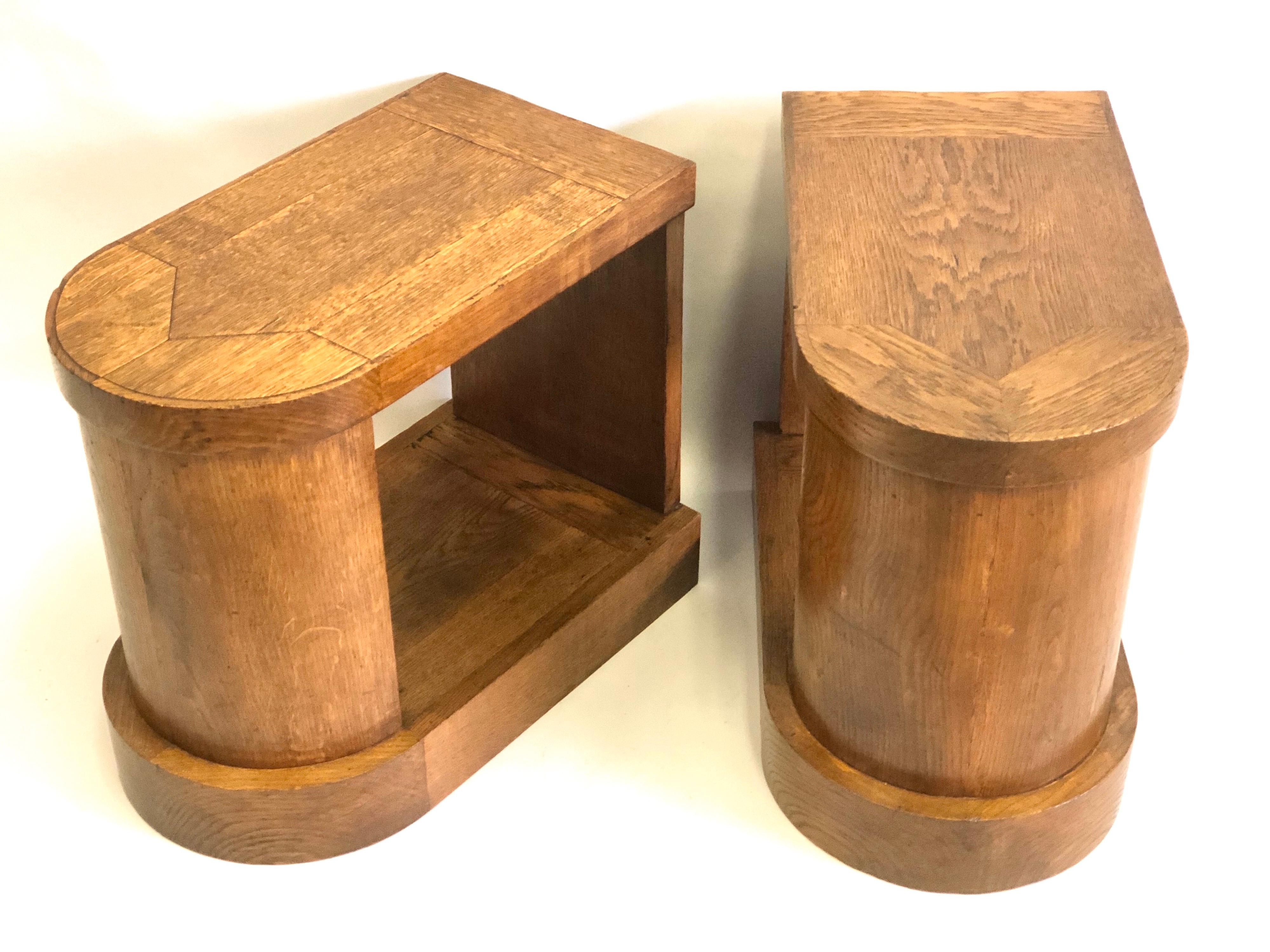Pair of handmade French Mid-Century Modern oak nightstands or side tables or end tables in the style of Pierre Legrain, circa 1925-1930.

The pieces have a sensuous French Art Deco influence with their smooth and flowing lines. They feature