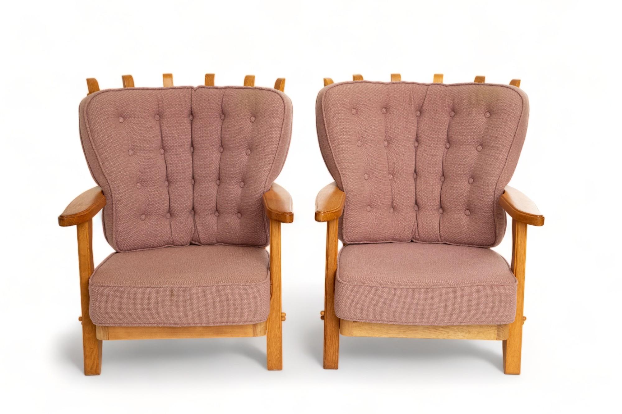 Pair of oak lounge chairs by Guillerme et Chambron, France 1960
This model is a mid repos 
Sculptural organic shape, finger back 
Retains a beautiful warm patina
These chairs have their own original wool fabric, light purple
Could be upholstered to