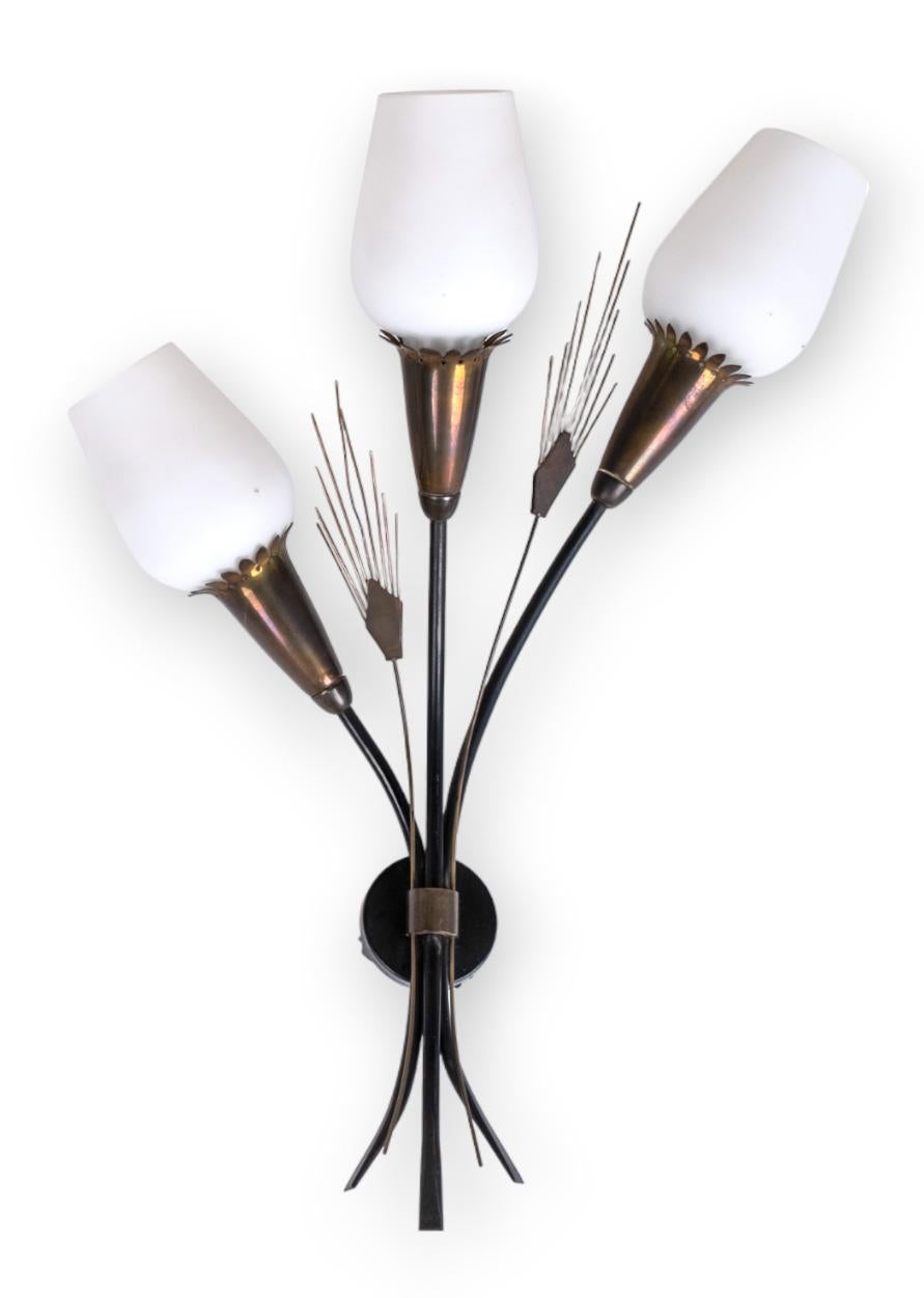 Pair of Mid-Century modern sconces, Circa 1960's. Each sconce is crafted from brass and features three elegantly curved arms, each holding a tulip-shaped milk glass shade. Uses bayonet bulb mount.

Measurement: Sconce with Shade: 19 1/4 x 15 in.