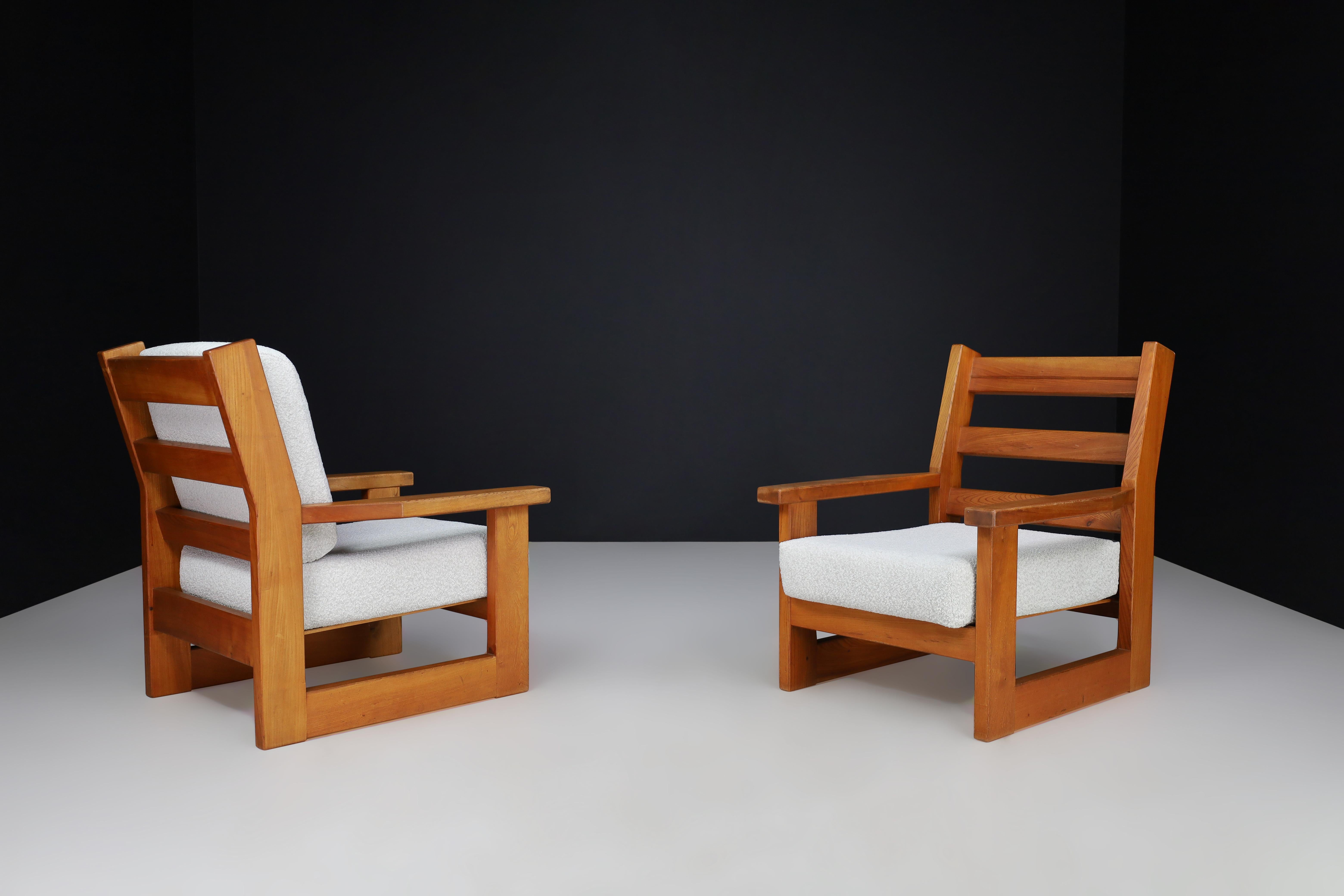 Pair of French Mid-Century Oak Armchairs with Bouclé Upholstery, 1960s

A sculptural and inviting pair of French mid-century armchairs, crafted from solid oak with strong geometric lines and newly upholstered in a soft ivory bouclé. These chairs