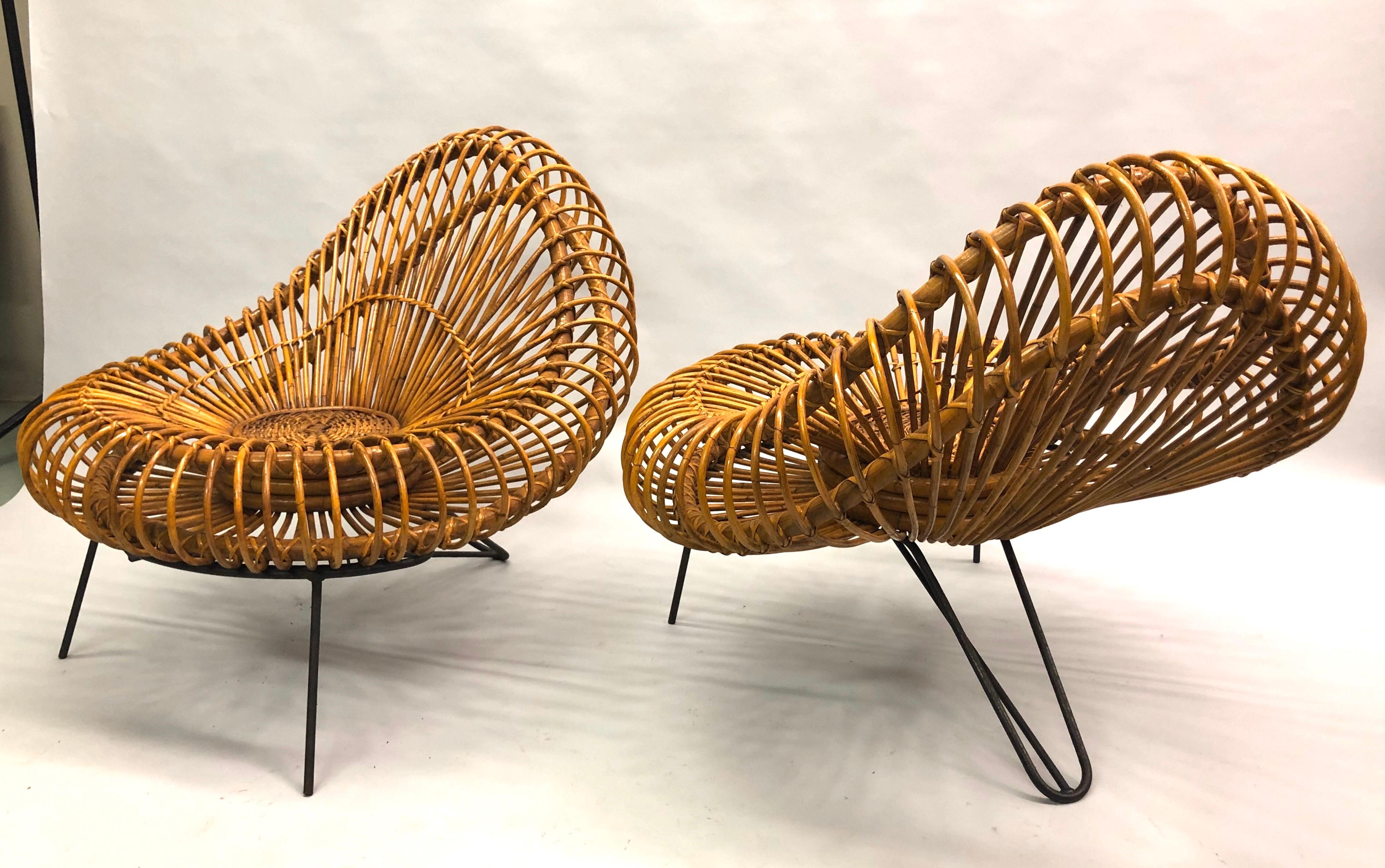 A confident, timeless, modern statement. An elegant and iconic pair of French Mid-Century Modern rattan basket lounge chairs / armchairs by Janine Abraham and Dirk Jan Rol, France, 1955. The original design incorporates the idea of a transparent