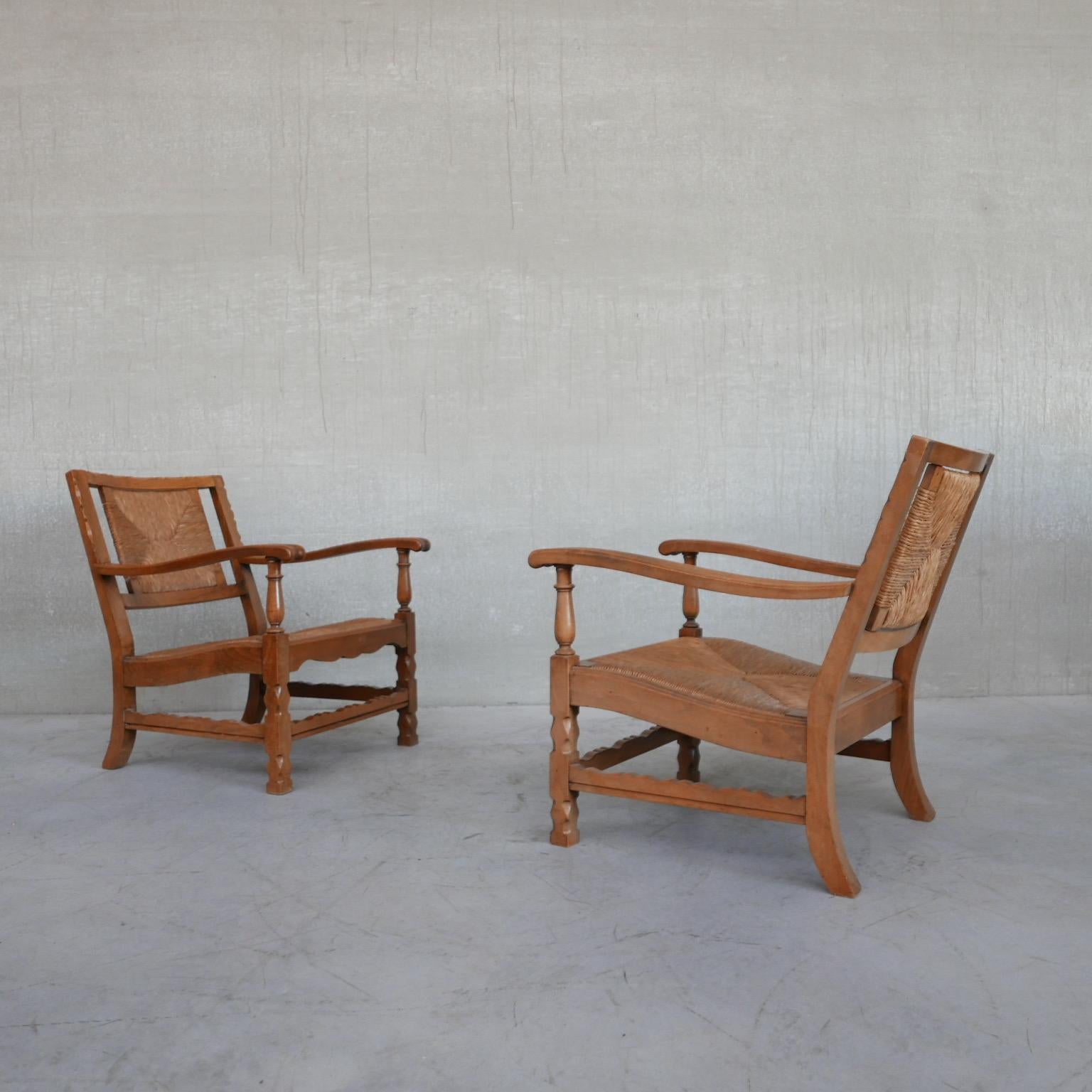 A pair of stylish rush armchairs. 

France, c1950s. 

Carved wood and rush. The rush remains in good condition. 

Comfy, deep armchairs which compliment a traditional and modern interior. 

Location: Belgium Gallery. 

Dimensions: 59 W x