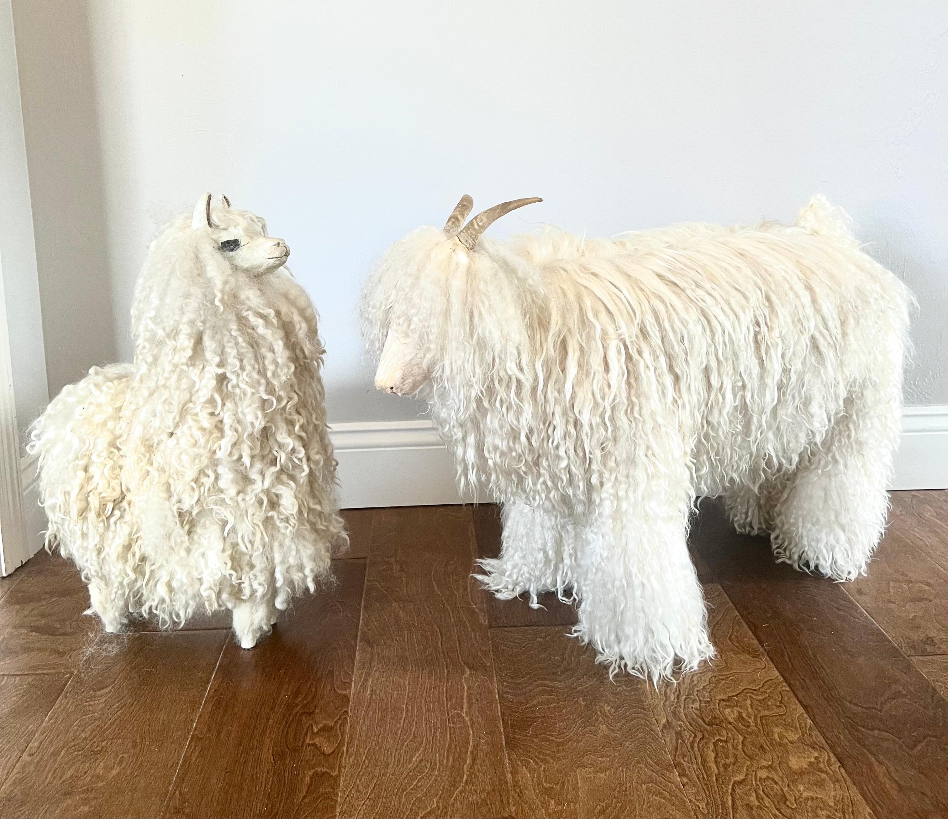 2 Rare French Midcentury Animal Sculptures / Stools or Ottomans. The ensemble is composed of a sheep and a llama sculpture. The sheep and llama sculptures of wood and wool can be used as a footstools or decorative sculptures. 

When Claude and