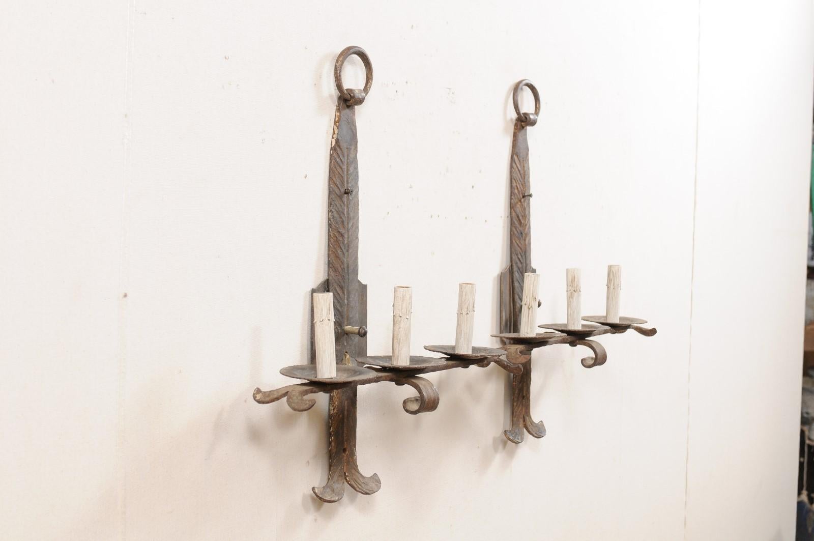 Patinated Pair of French Midcentury Three-Light Iron Sconces
