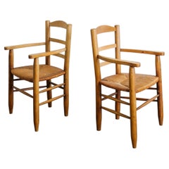 Paire de fauteuils en bois français du milieu du siècle attr. à Charlotte Perriand, années 1950