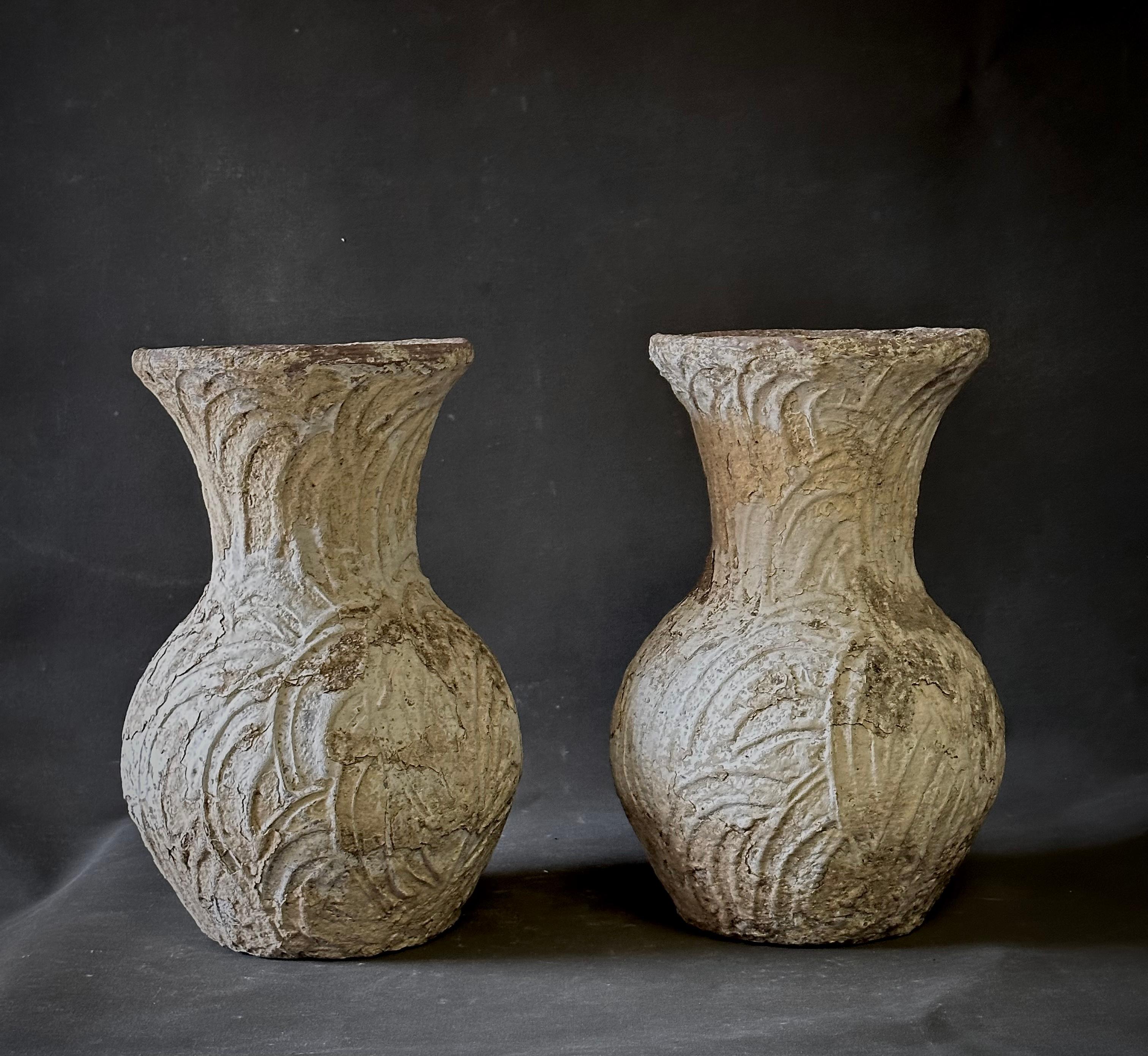 Pair of concrete pots from 1940s France. Great for both indoor and outdoor use, the mottled, chalky surface texture and hand-worn shape adds a touch of rustic elegance to any living space. 

France, circa 1940

Dimensions: 11W x 11D x 17.5H