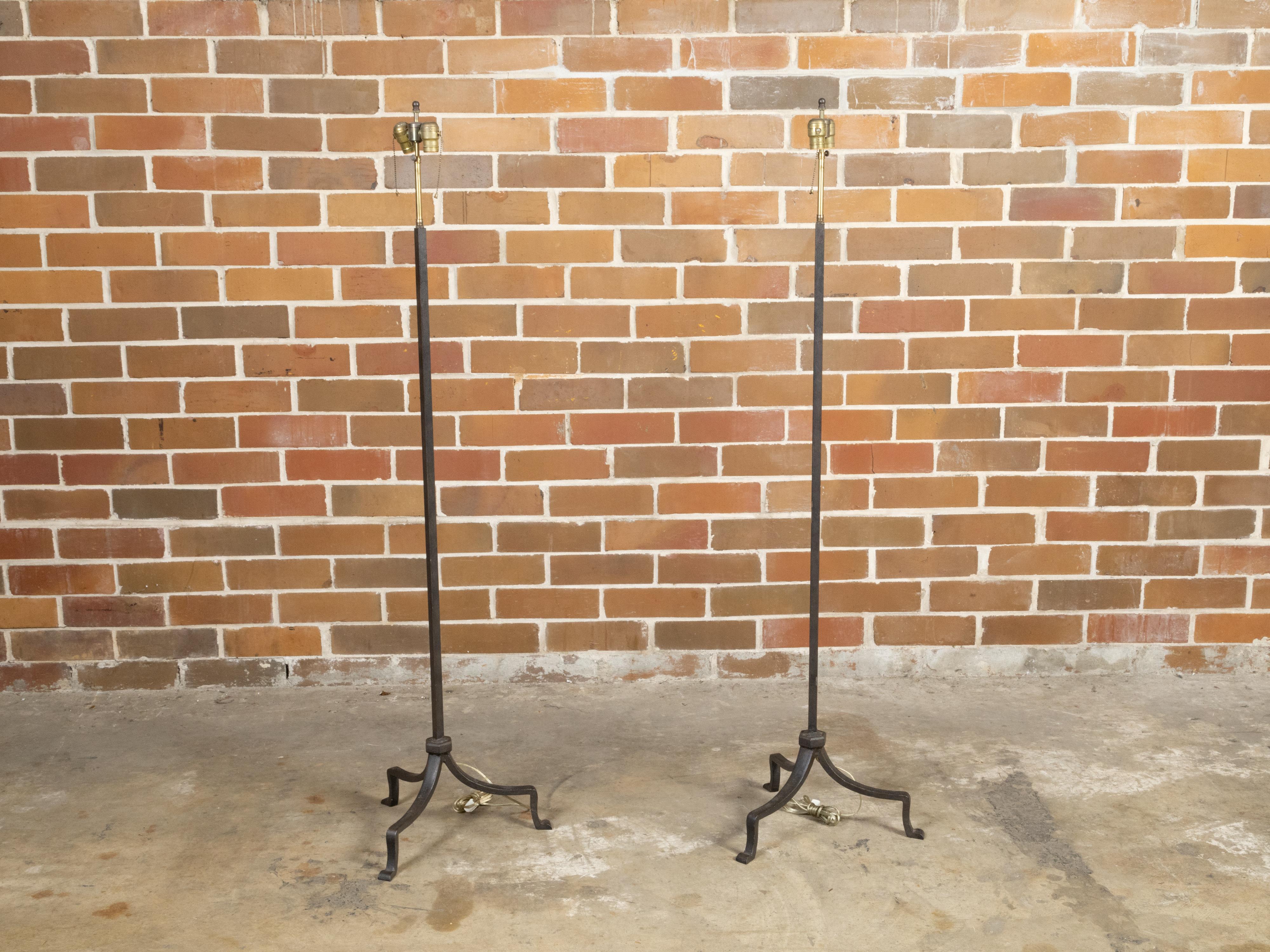 Pair of French Midcentury Iron Two-Light Floor Lamps with Tripod Bases In Good Condition In Atlanta, GA