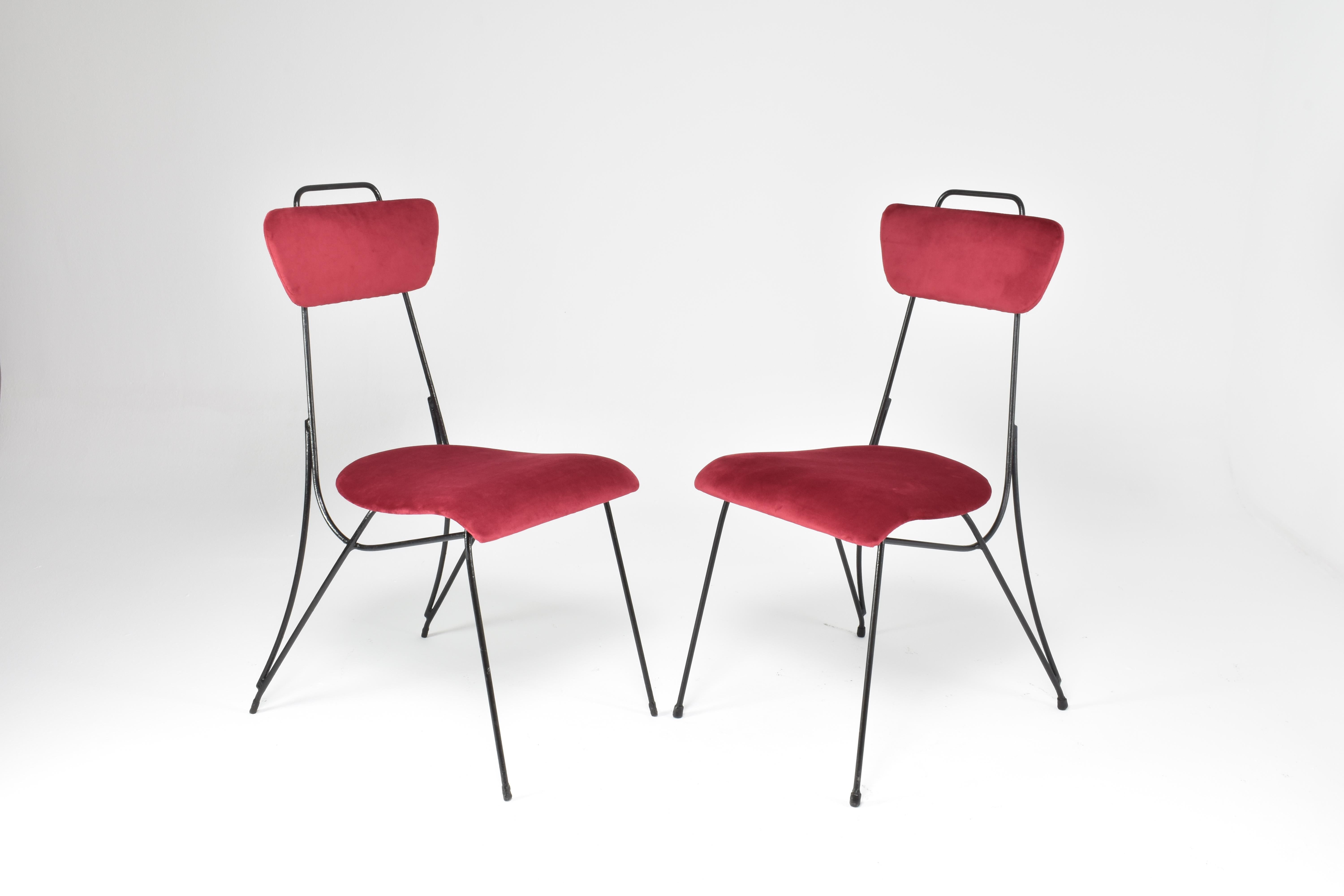 A very cool pair of chairs made in France in the 1950s designed with black tubular steel frame in its original vintage condition, highlighted by meticulously restored red velvet upholstery seat and backrest. 
France. 1950's
Price is per piece /