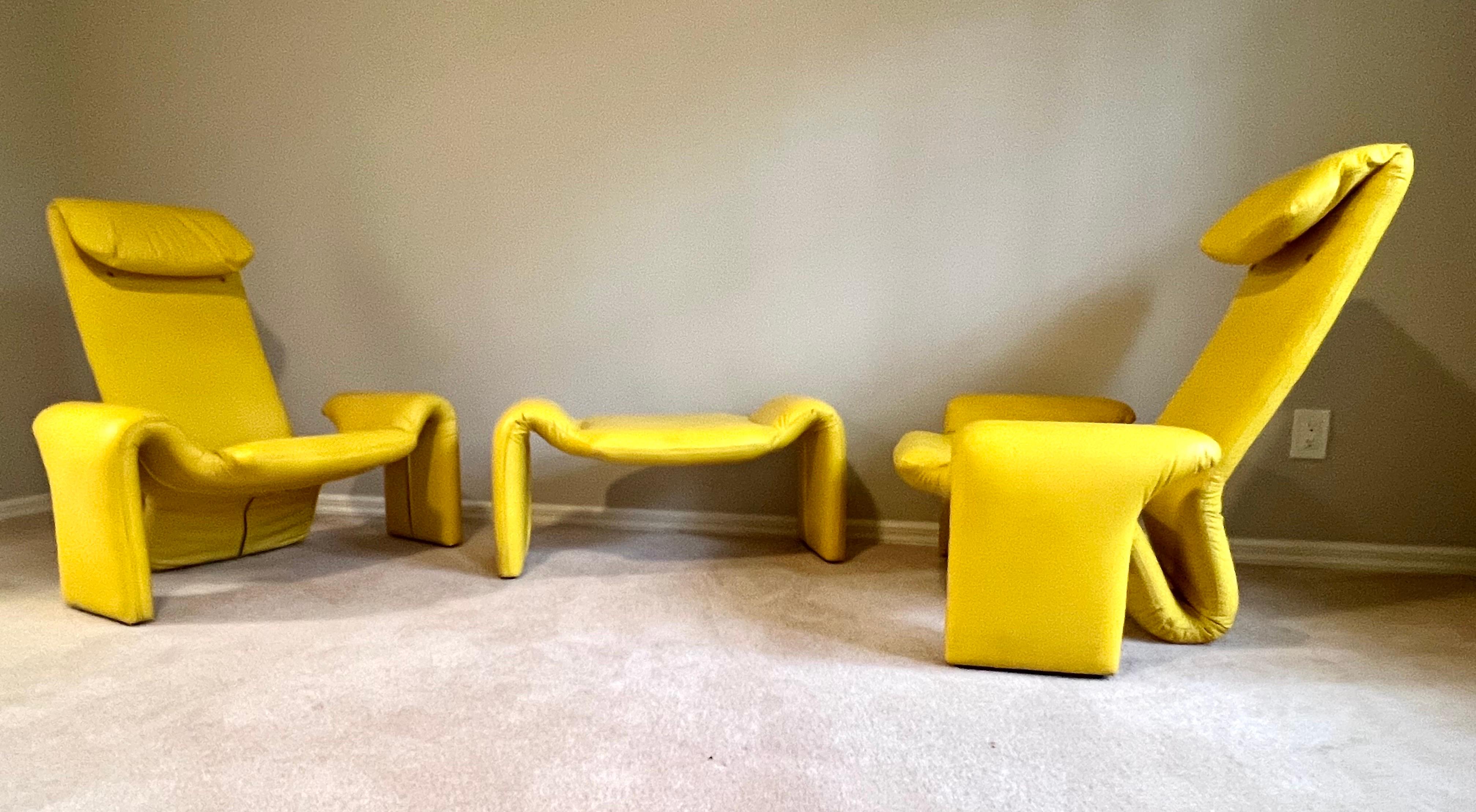 Pair of French MidCentury Modern Leather Lounge Chairs and Ottoman