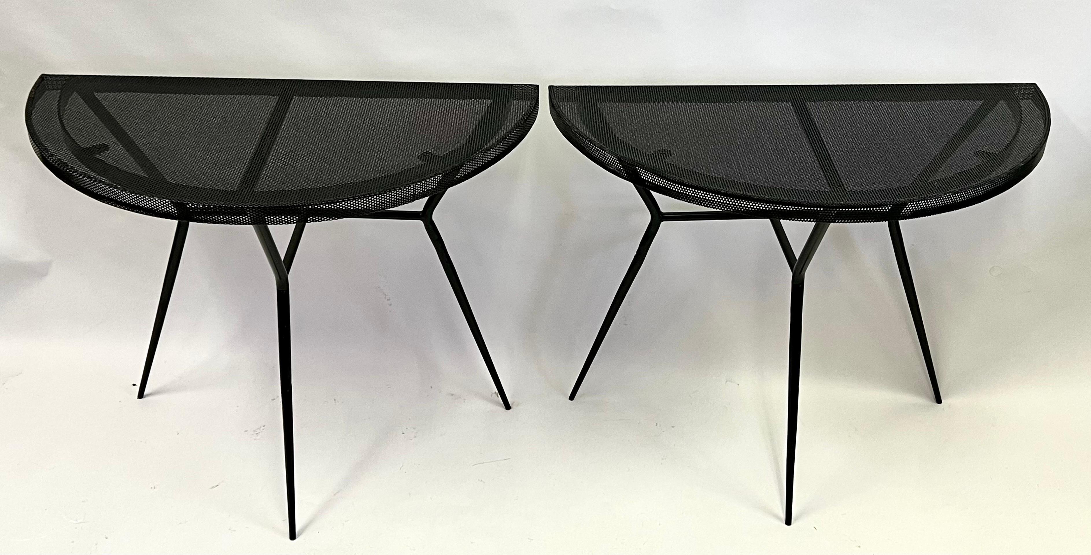 A rare and important pair of French Mid-Century Modern Consoles / Sofa Tables Attributed to Mathieu Mategot. The pieces are typical of Mategot and composed of perforated steel and enameled black; they are set upon architectural bases formed by 3